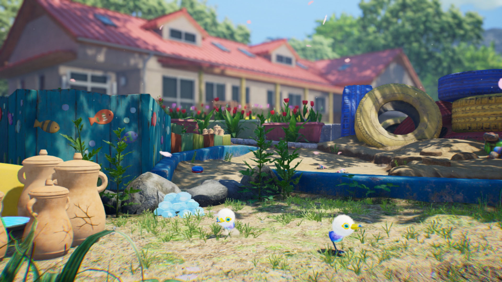 A sandbox in a garden with two cartoon birds. A house with a red roof is in the background.