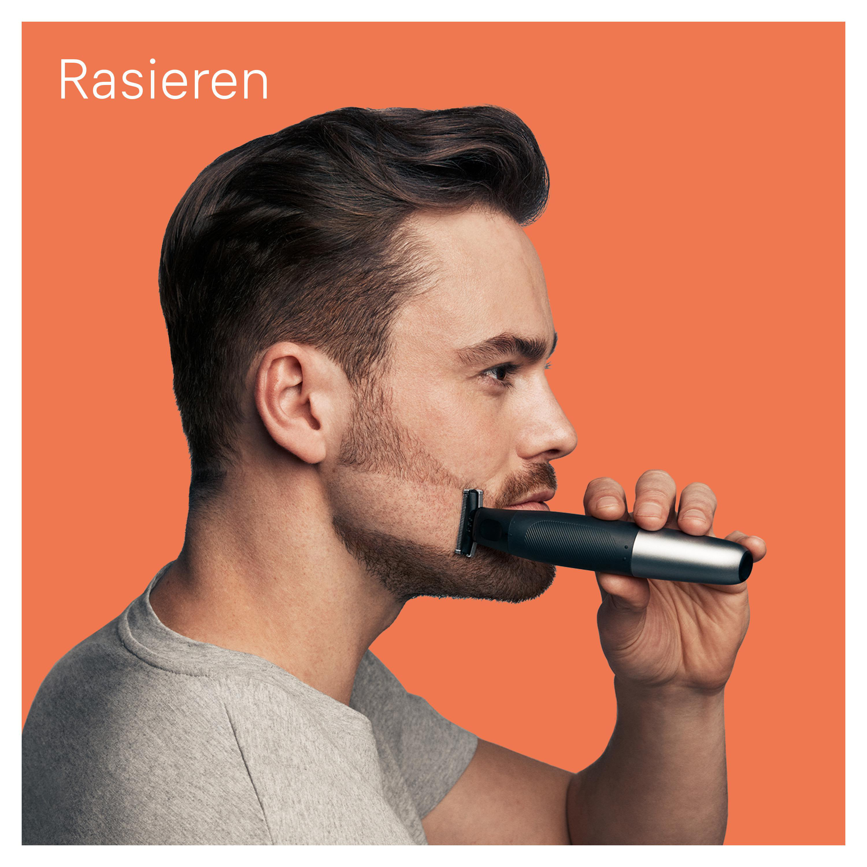 Mann rasiert Bart mit Trimmer, orangefarbener Hintergrund.