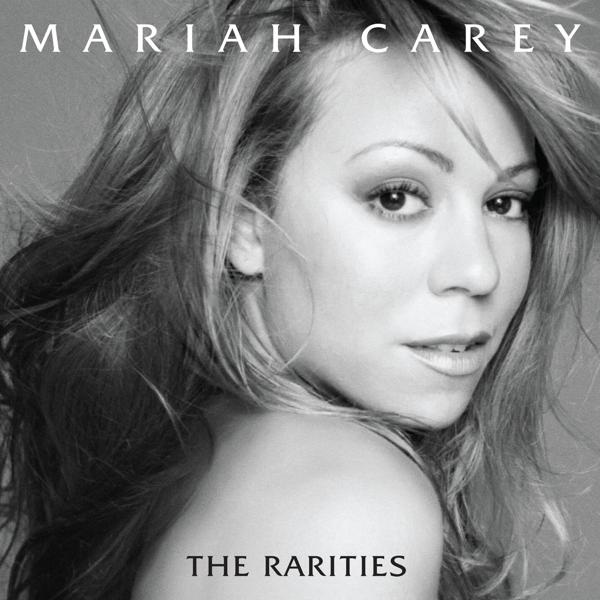 Mariah Carey album borítója az arcával és a szálló hajával, fekete-fehérben.