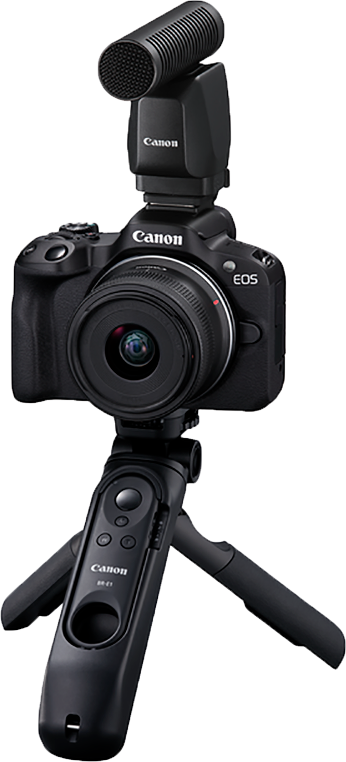 A Canon EOS camera with a microphone attached to a tripod.