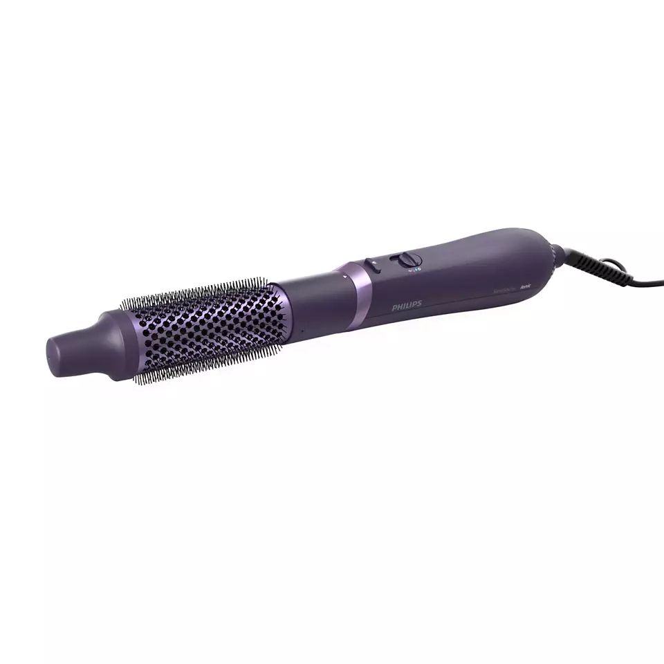 Violette Haarstylingbürste mit schwarzem Griff und Netzkabel.