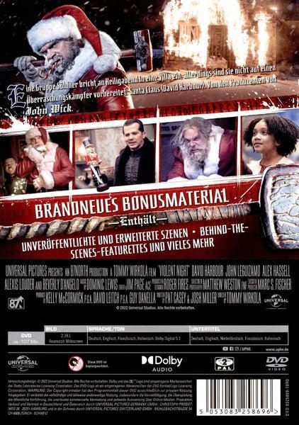 DVD-Cover mit Weihnachtsmann, brennendem Gebäude und Text in mehreren Sprachen.
