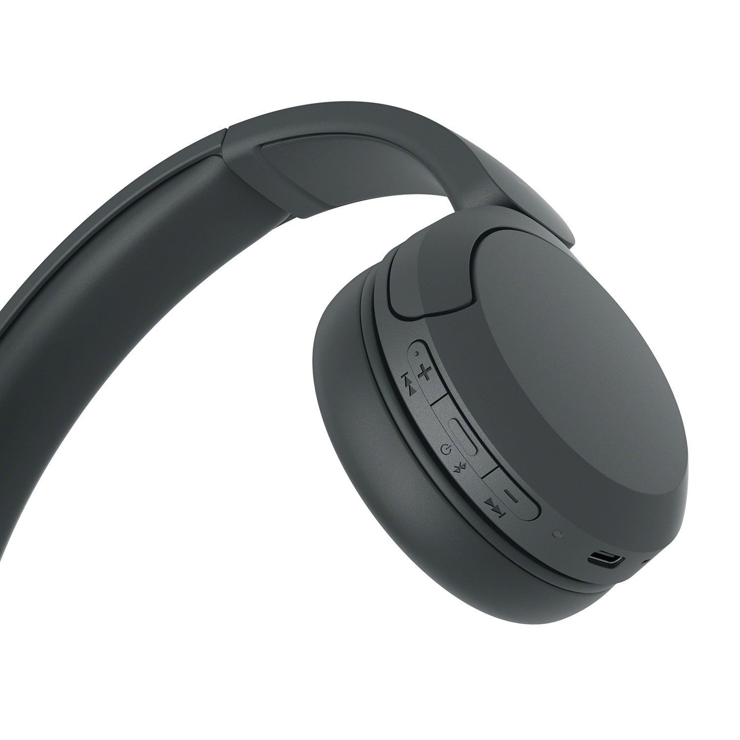 Una cuffia wireless grigia, angolata, isolata su sfondo bianco, che mostra i pulsanti.