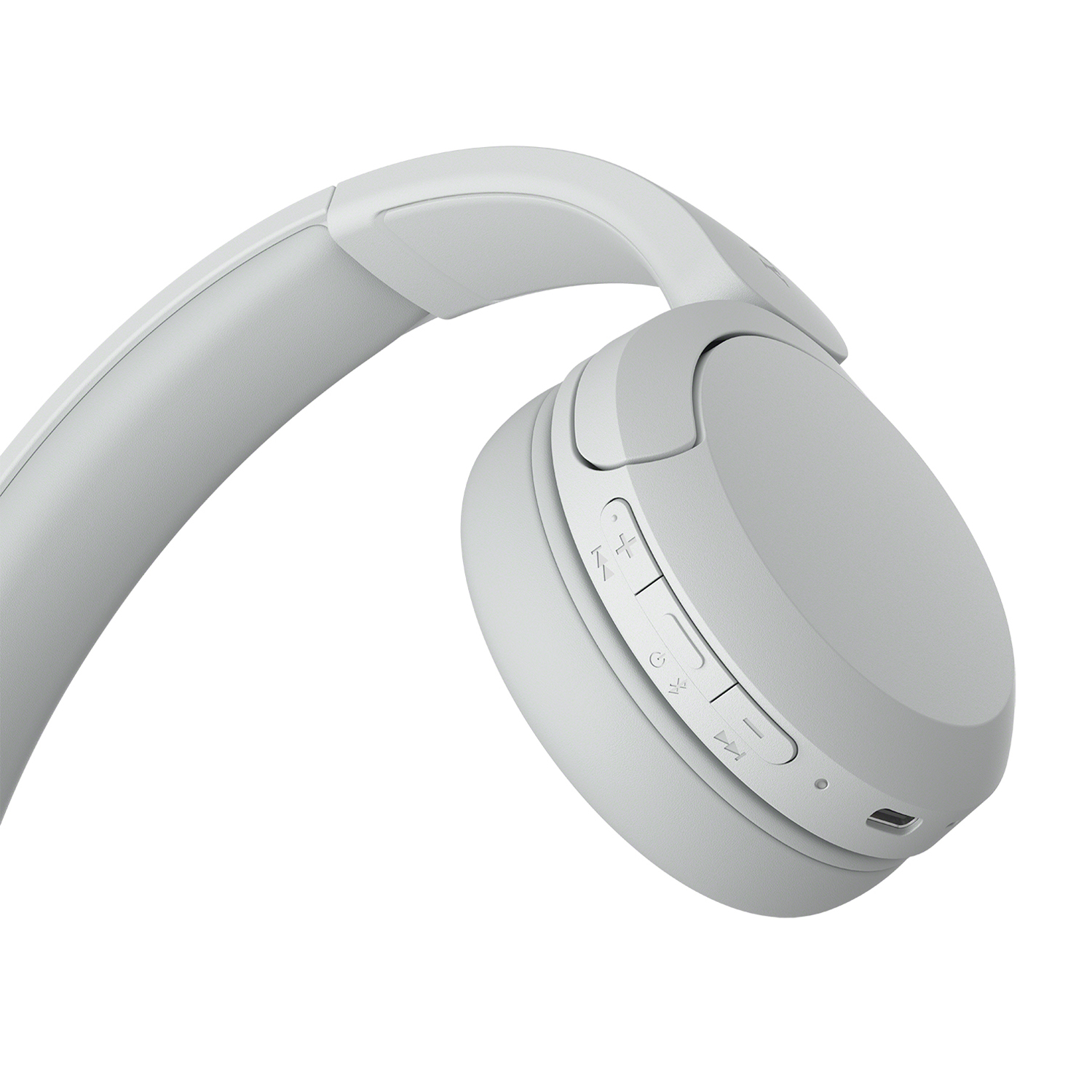 Cuffie grigio chiaro over-ear, angolate, che mostrano pulsanti e dettagli del design.