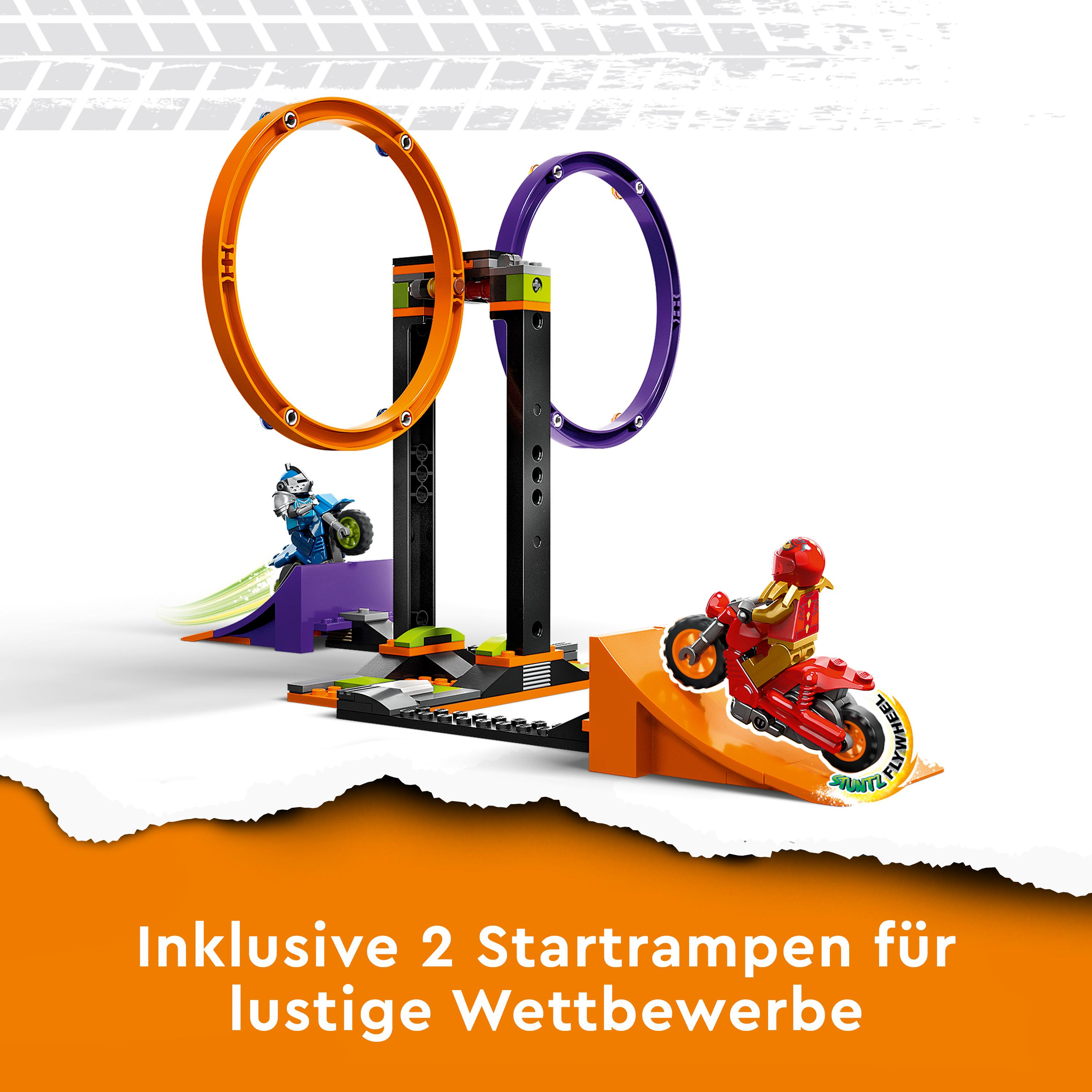 Spielzeug-Motorradstrecke. Zwei Motorräder rasen auf Loopings zu. Bunte Rampen und Hindernisse werden angezeigt.