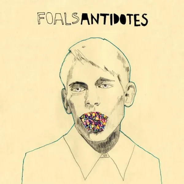 Album borító: Egy férfi színes szájjal. A tetején a 'FOALS ANTIDOTES' szöveg.