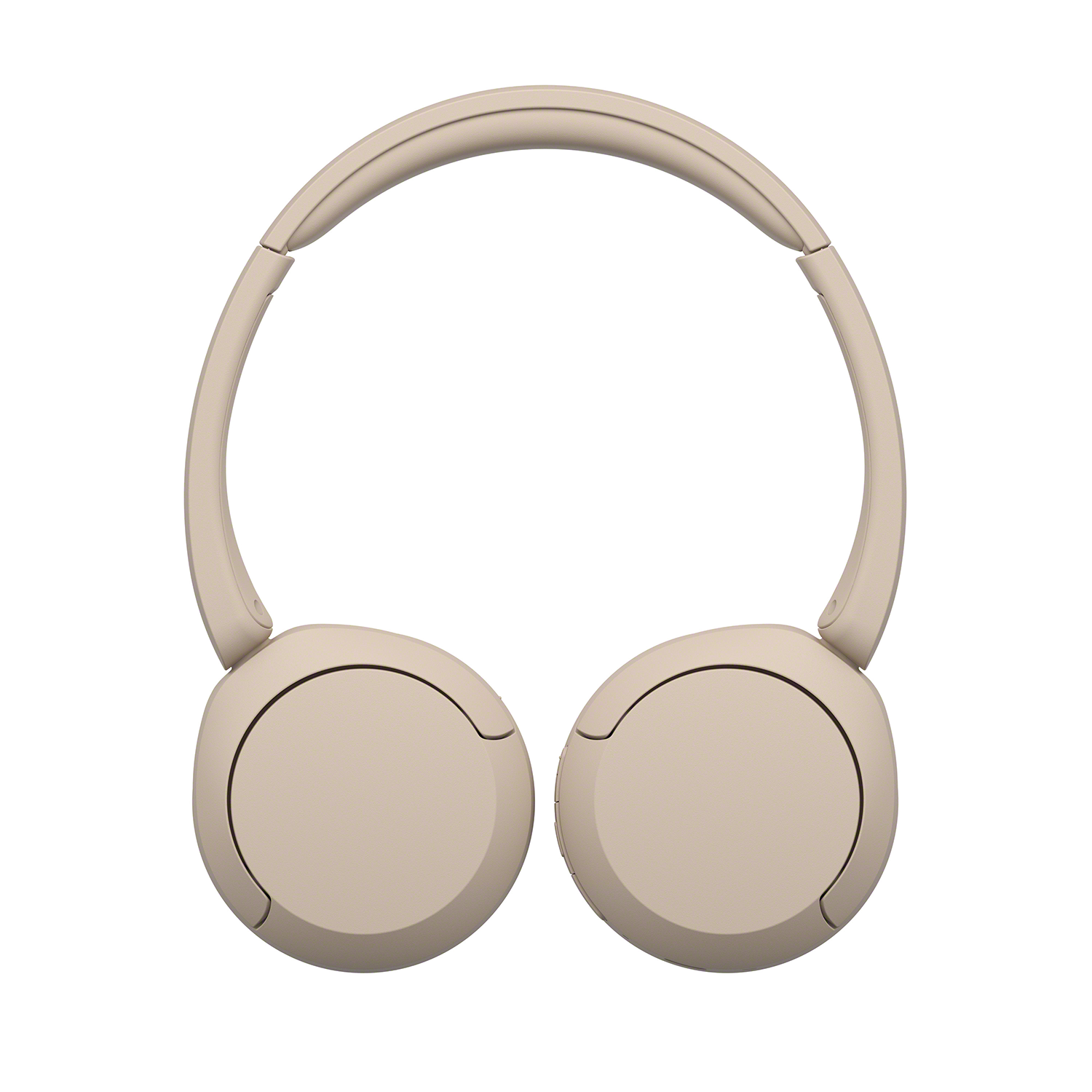 Beige koptelefoon. De oorschelpen zijn afgerond en de hoofdband is gebogen.