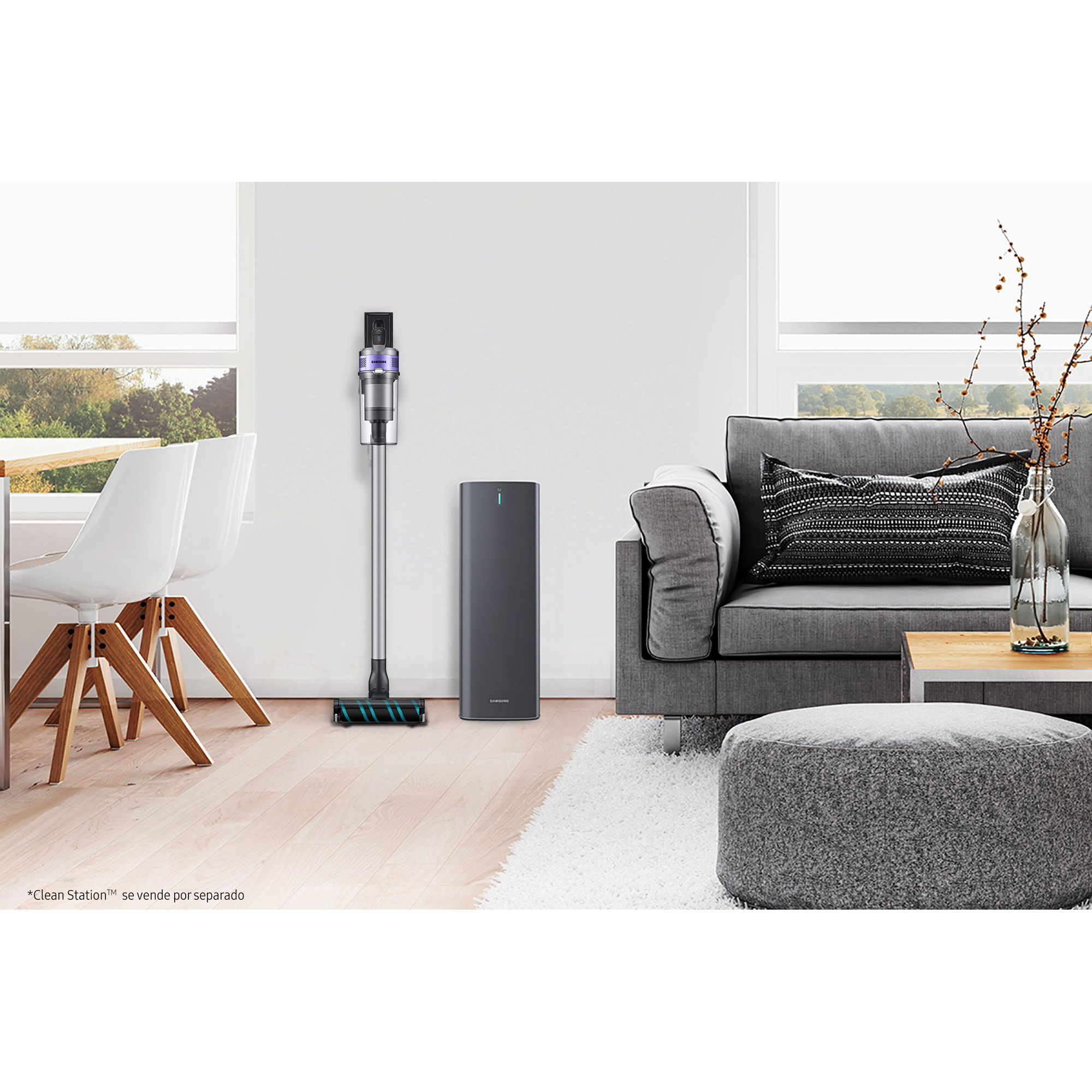 Una sala de estar moderna con una aspiradora, un purificador de aire y muebles grises.