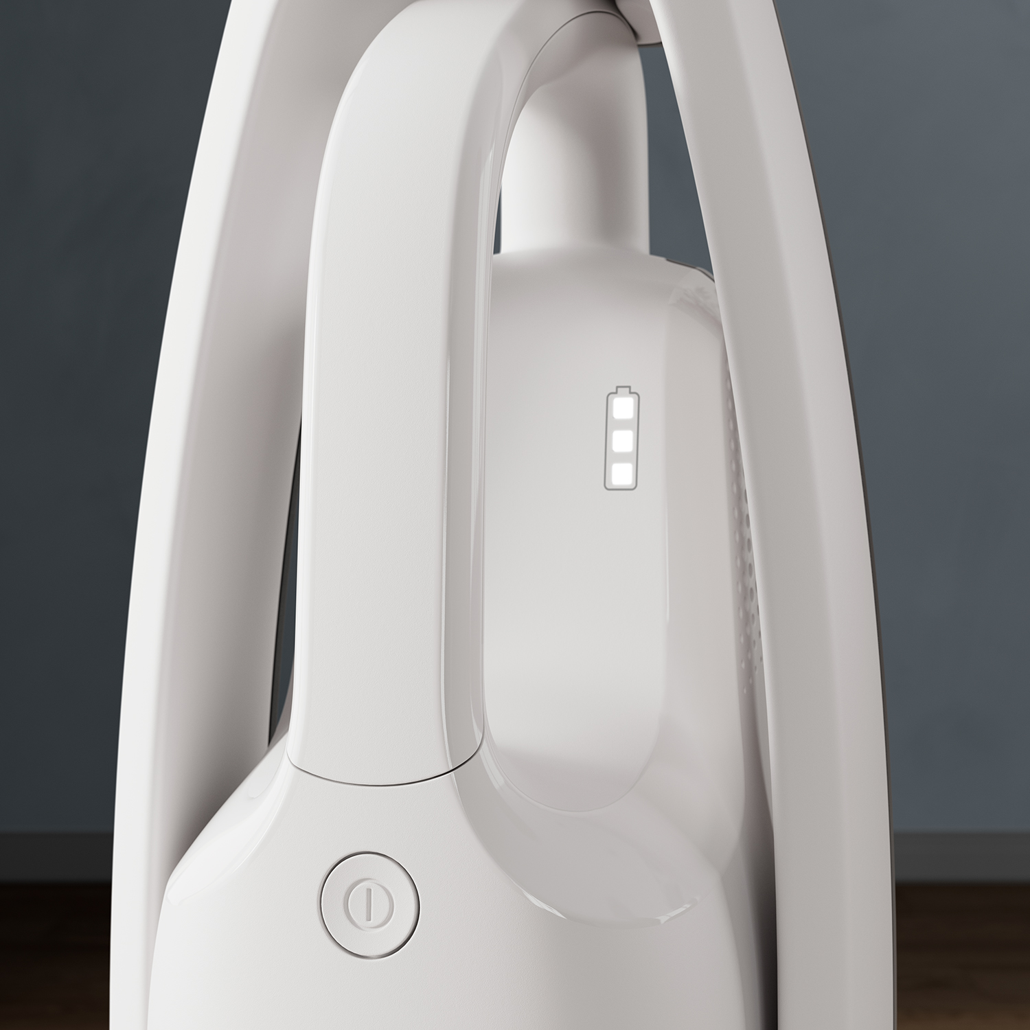 A white vacuum cleaner handle with a power button and battery indicator. Close up shot.