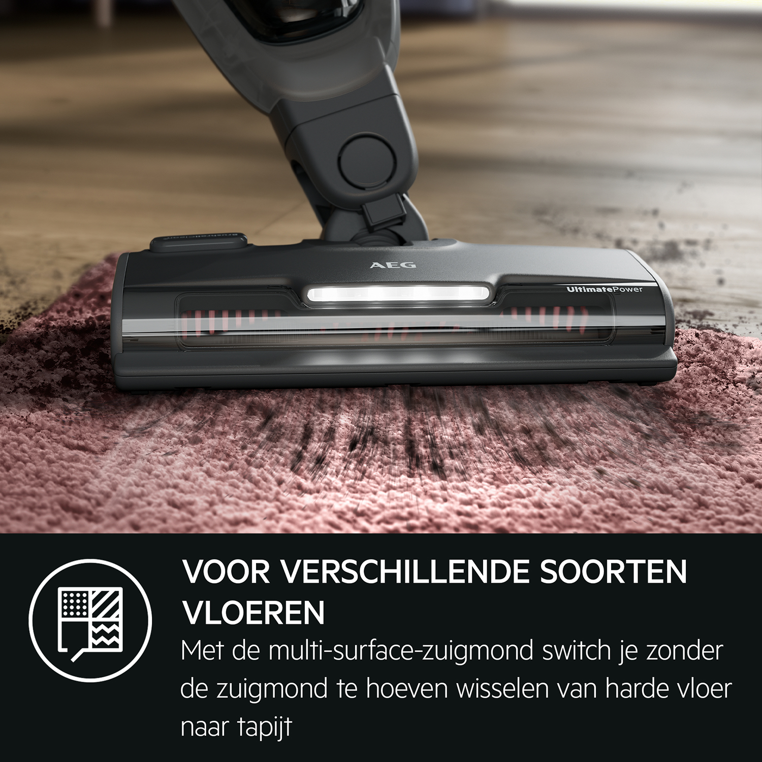 A vacuum cleaner head cleaning a pink rug. The head is black with a white light.