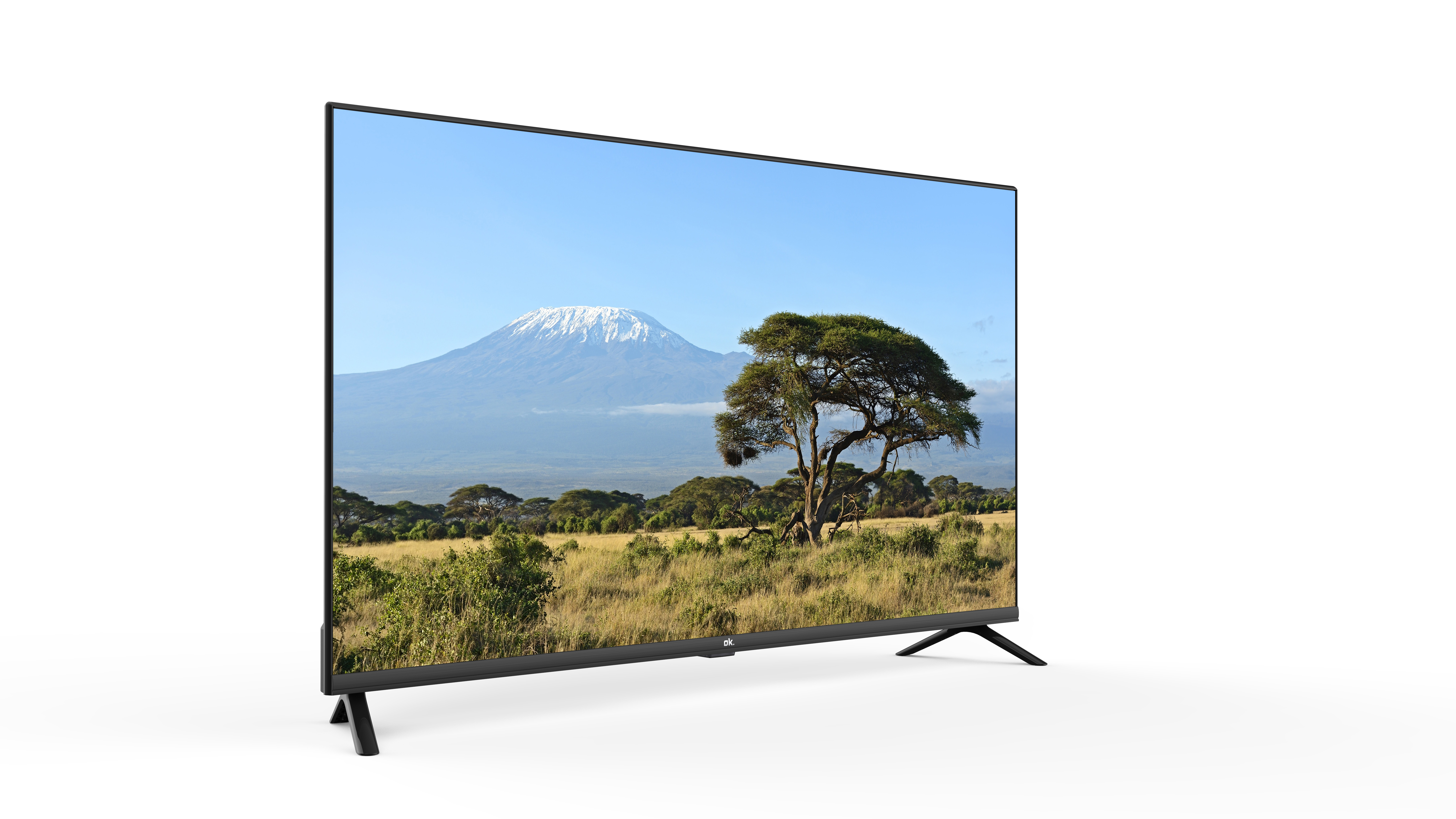 Un televisor grande que muestra una vista panorámica. El fondo tiene montaña.