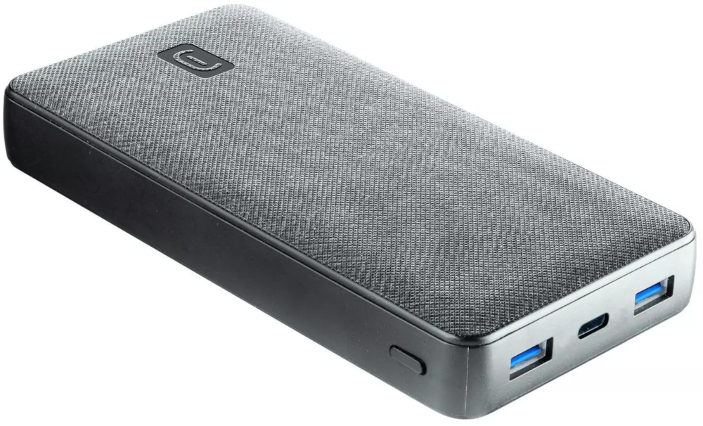 Batterie externe grise avec ports USB, posée sur une surface.
