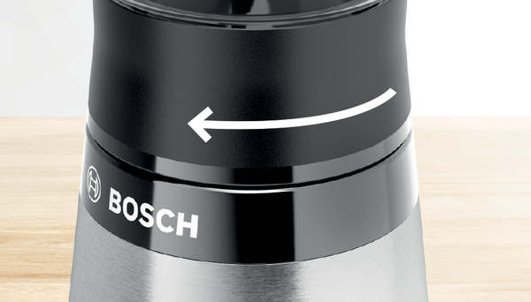Dönüşü gösteren bir ok ile bir Bosch elektrikli öğütücünün yakın çekimi.
