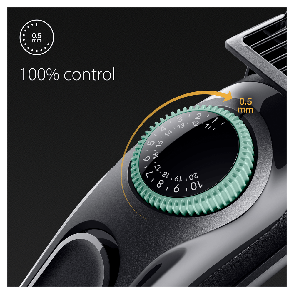 Primer plano de una recortadora negra y verde con un dial que muestra '0,5 mm' y el texto '100% control'.