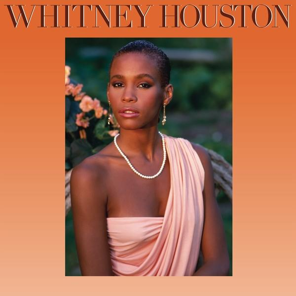 Whitney Houston album borítója. Rózsaszín ruhát és gyöngy nyakláncot visel. Narancssárga színátmenetes háttér.