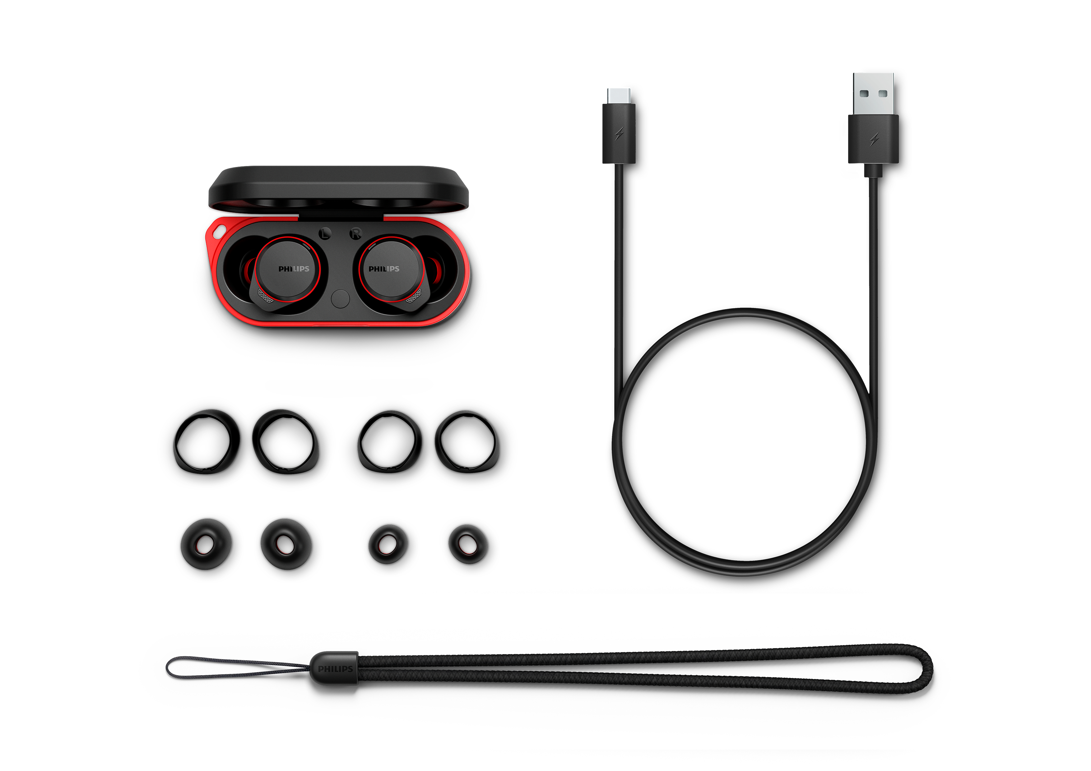 Ohrhörer, Ladecase, USB-C-Kabel und zusätzliche Ohrstöpsel auf weißem Hintergrund.