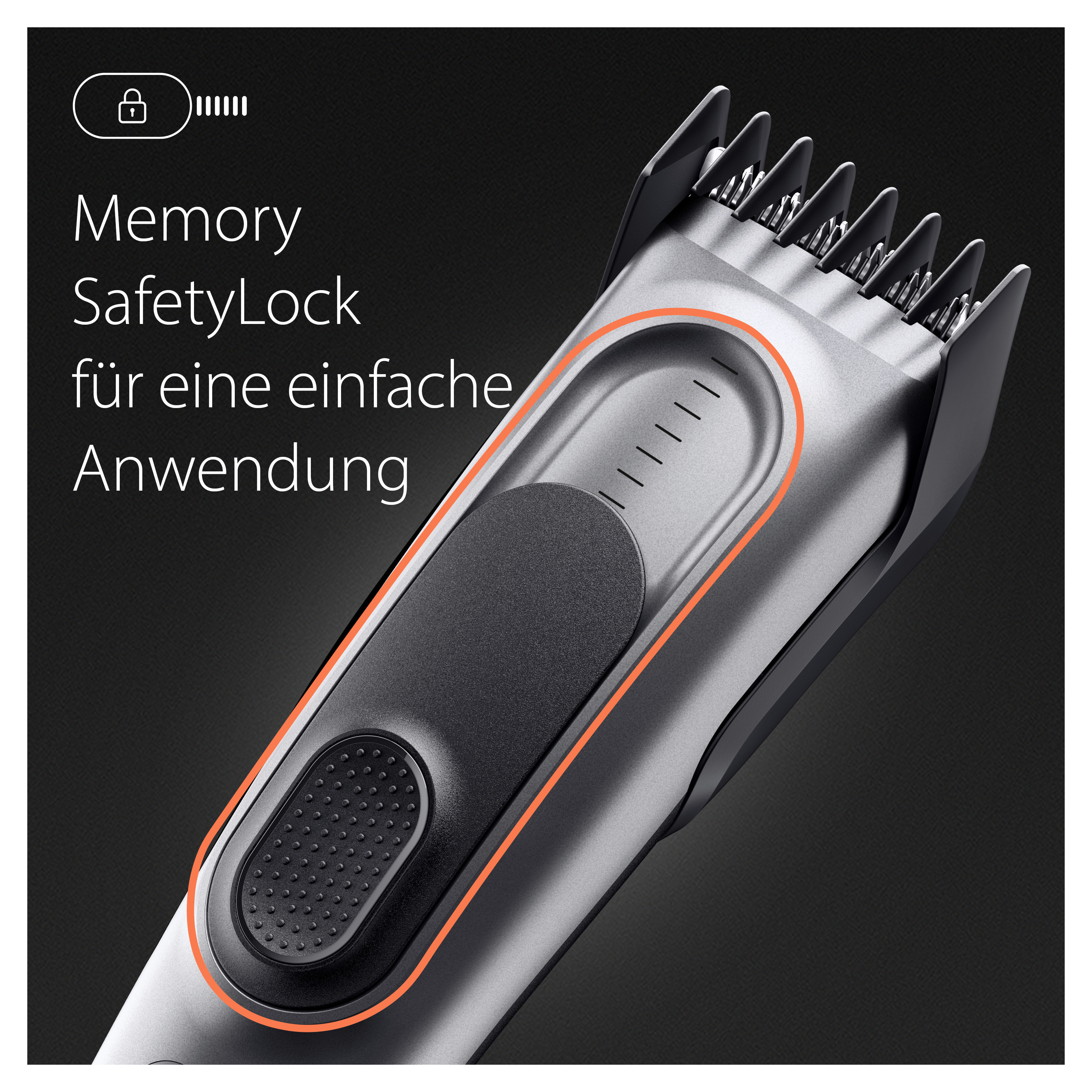 Nahaufnahme eines silber-schwarzen Haarschneiders mit orangefarbenem Akzent.
