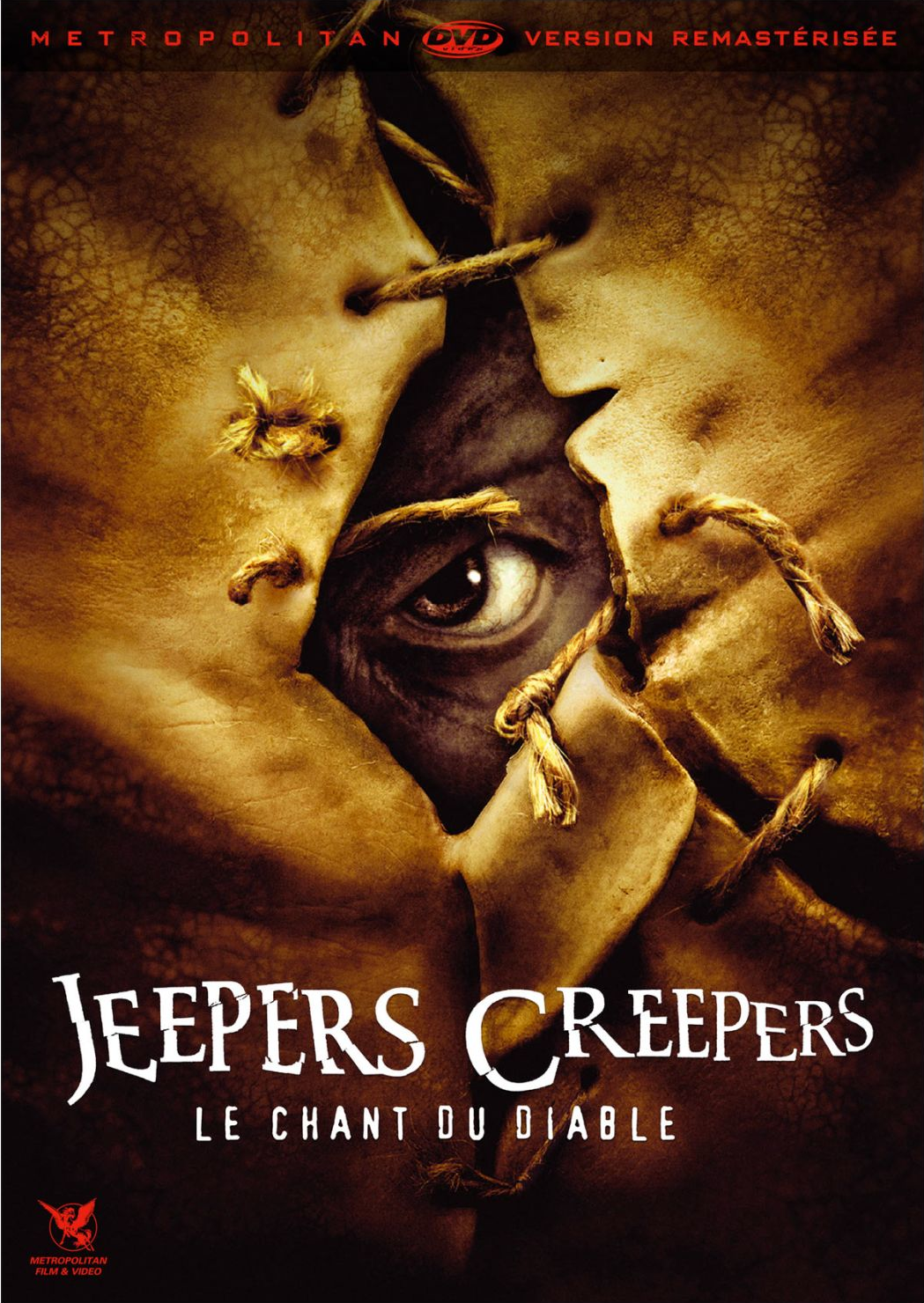 Couverture du film 'Jeepers Creepers' : Œil regardant à travers un tissu cousu.