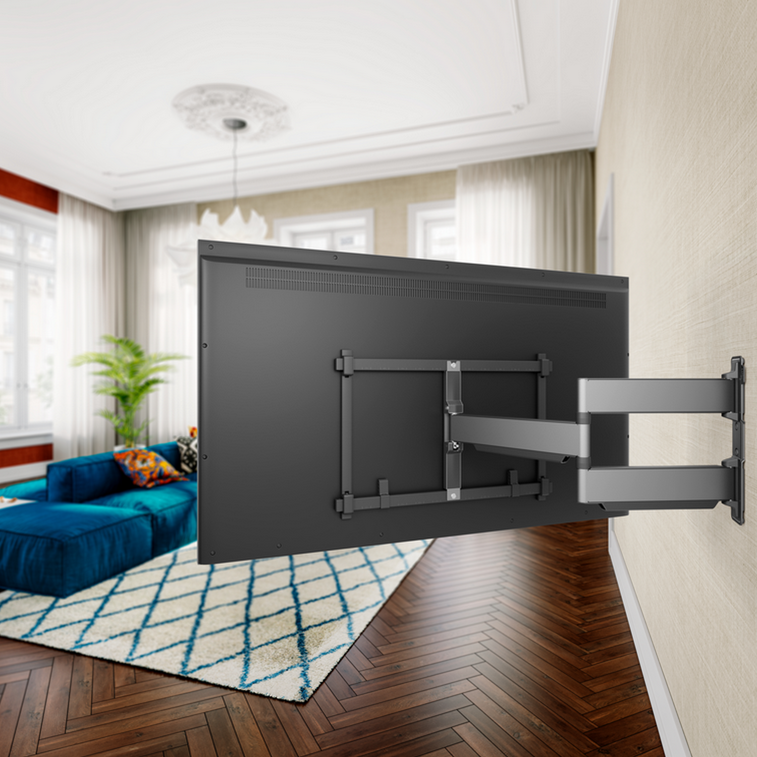 TV mounted on a wall with a decorative living room in the background.