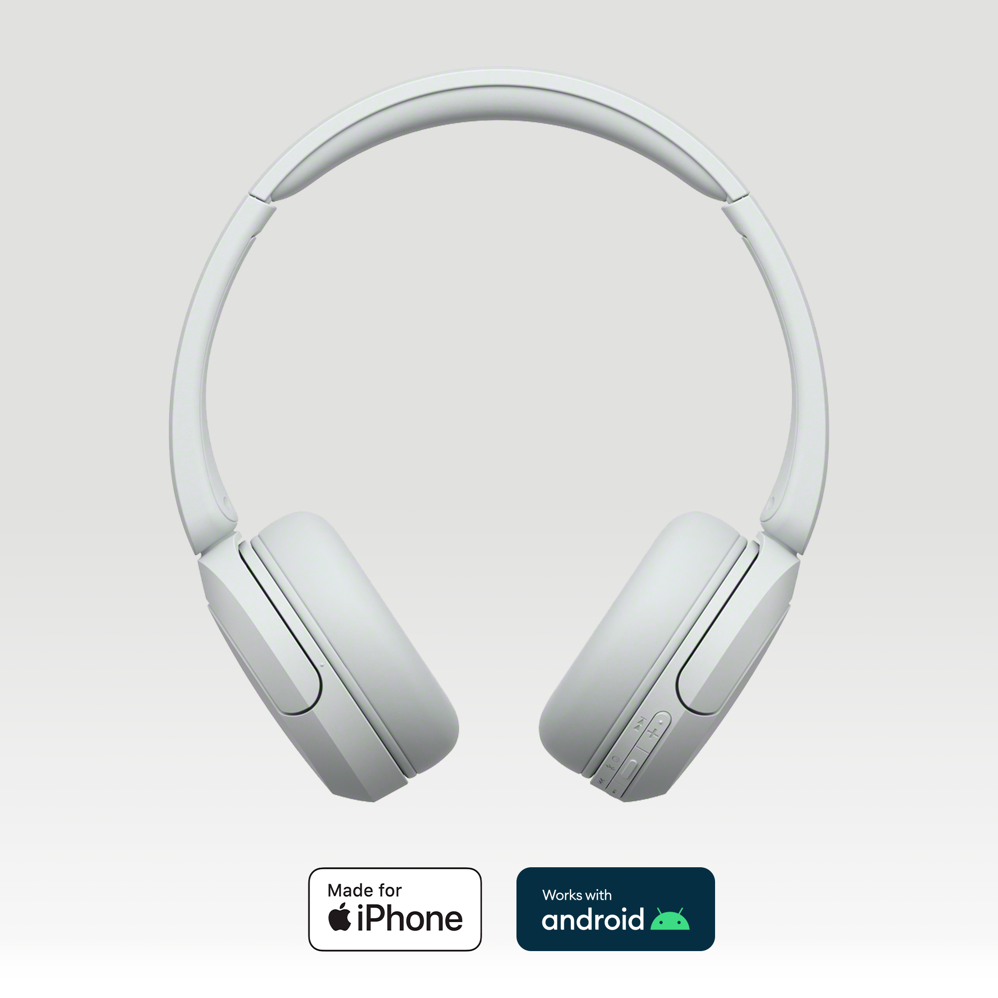 Casque blanc avec serre-tête et écouteurs. Les logos iPhone et Android sont visibles.