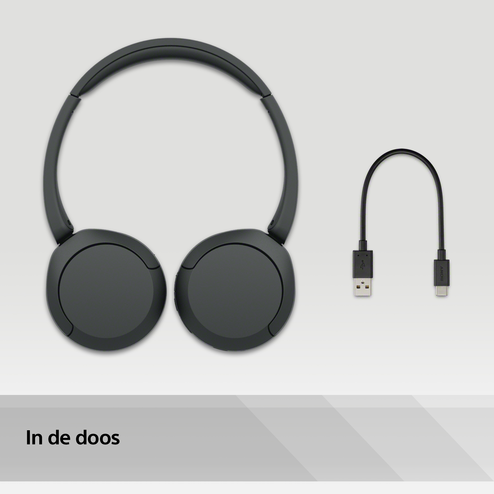 Headphones, cable on white surface.