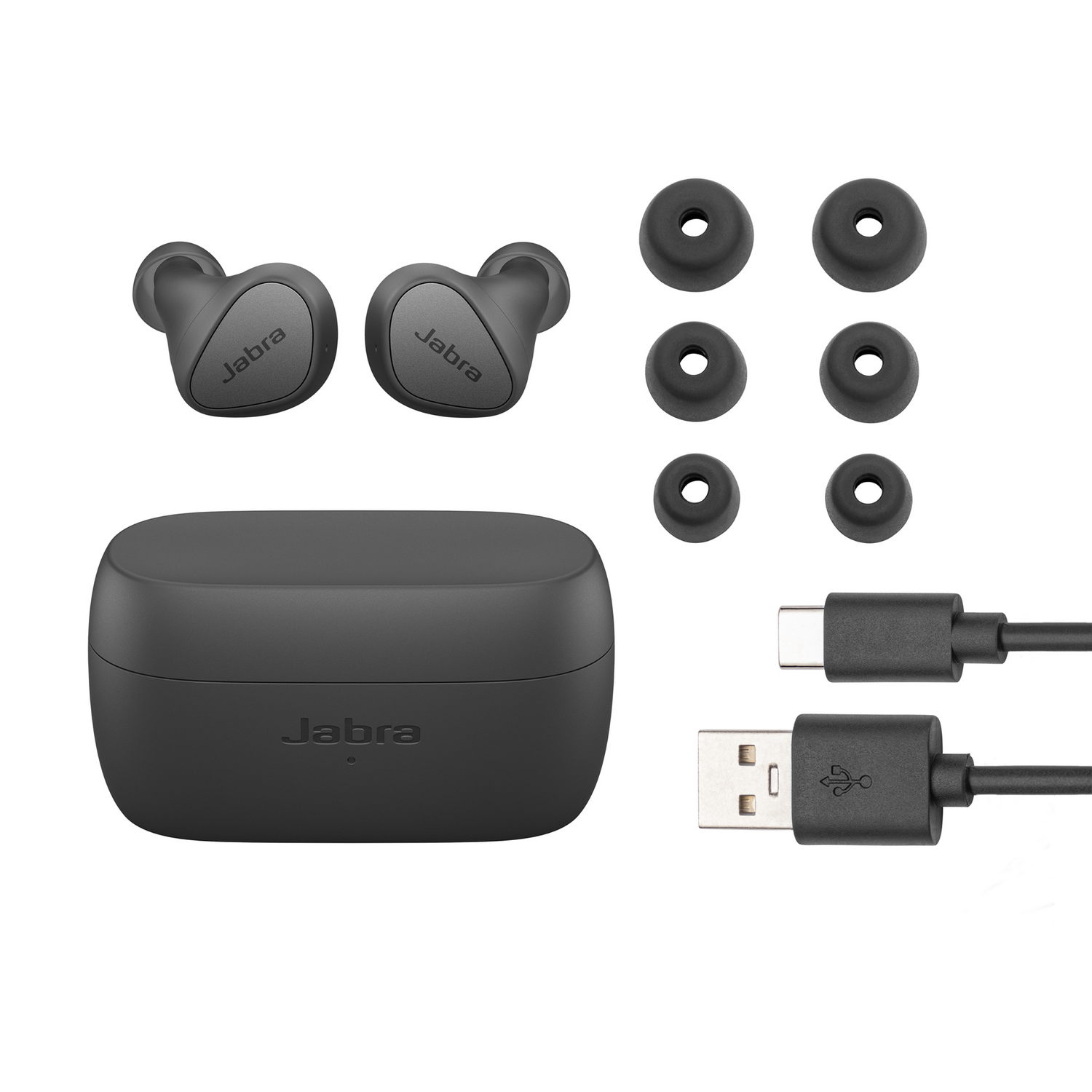 Zwarte Jabra oortjes, oplaadcase, extra oordopjes en oplaadkabels.