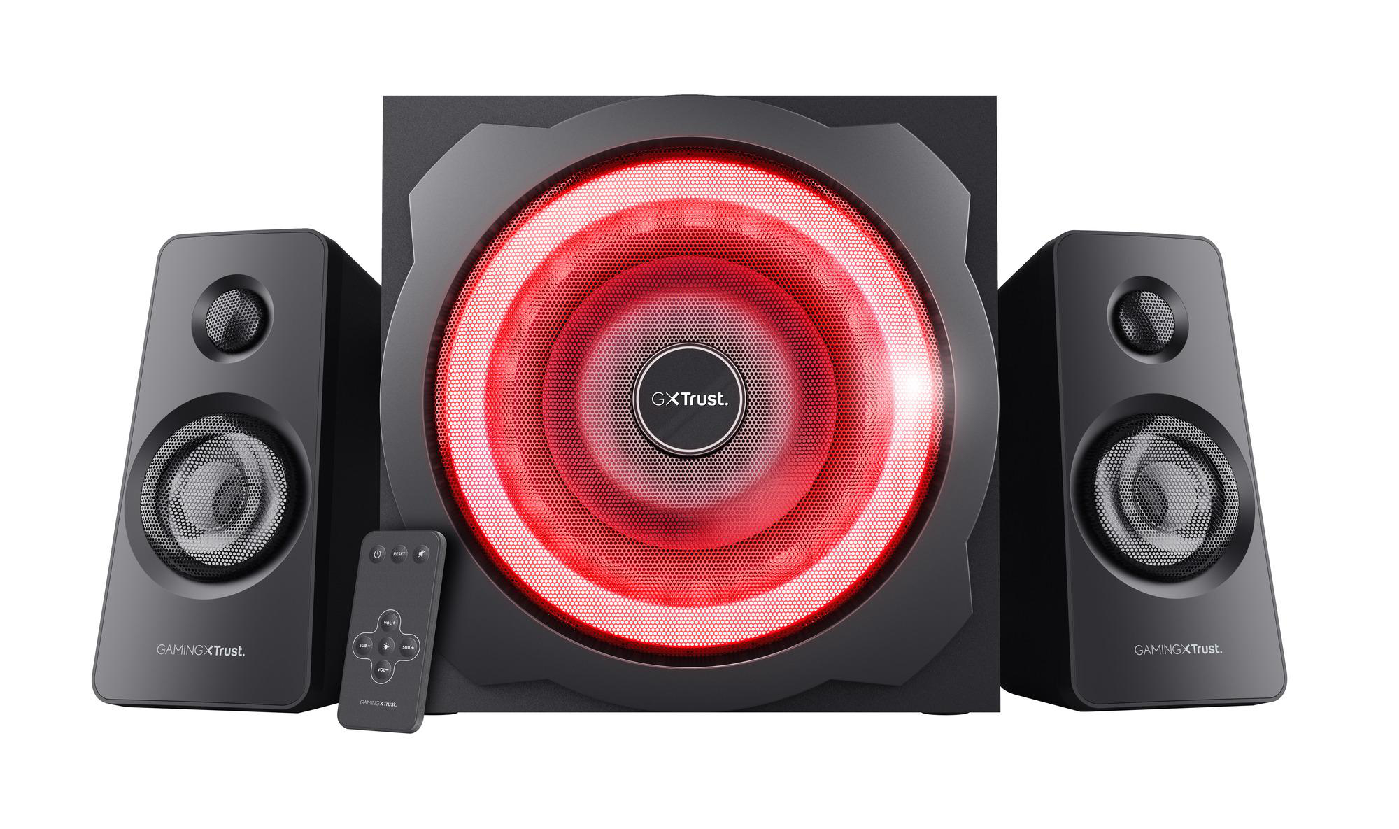 Ein schwarzes 2.1-Gaming-Lautsprecherset mit einem großen Subwoofer mit roter Beleuchtung und kleiner Fernbedienung.