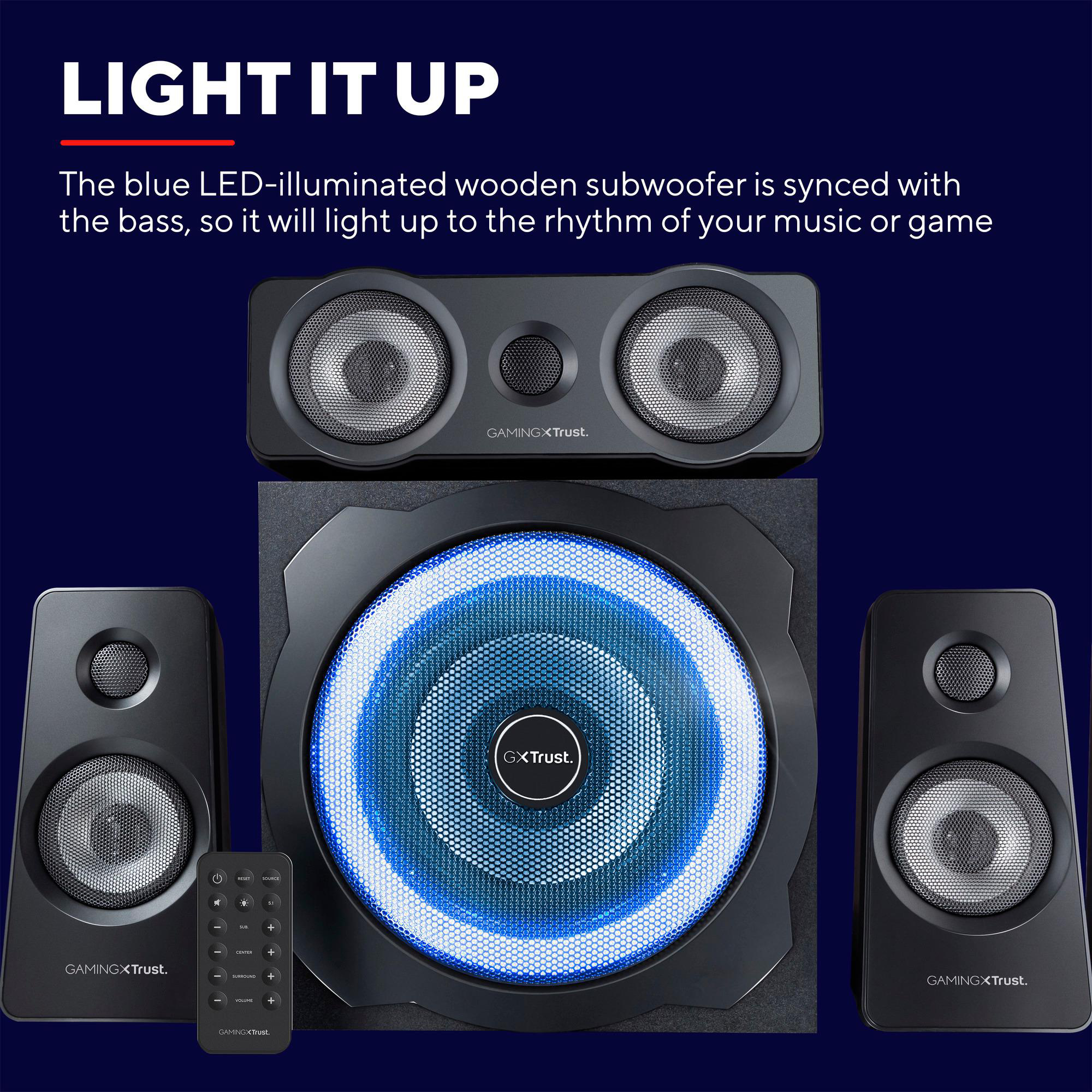 Gaming-Lautsprecherset mit blau beleuchtetem Subwoofer und Fernbedienung.