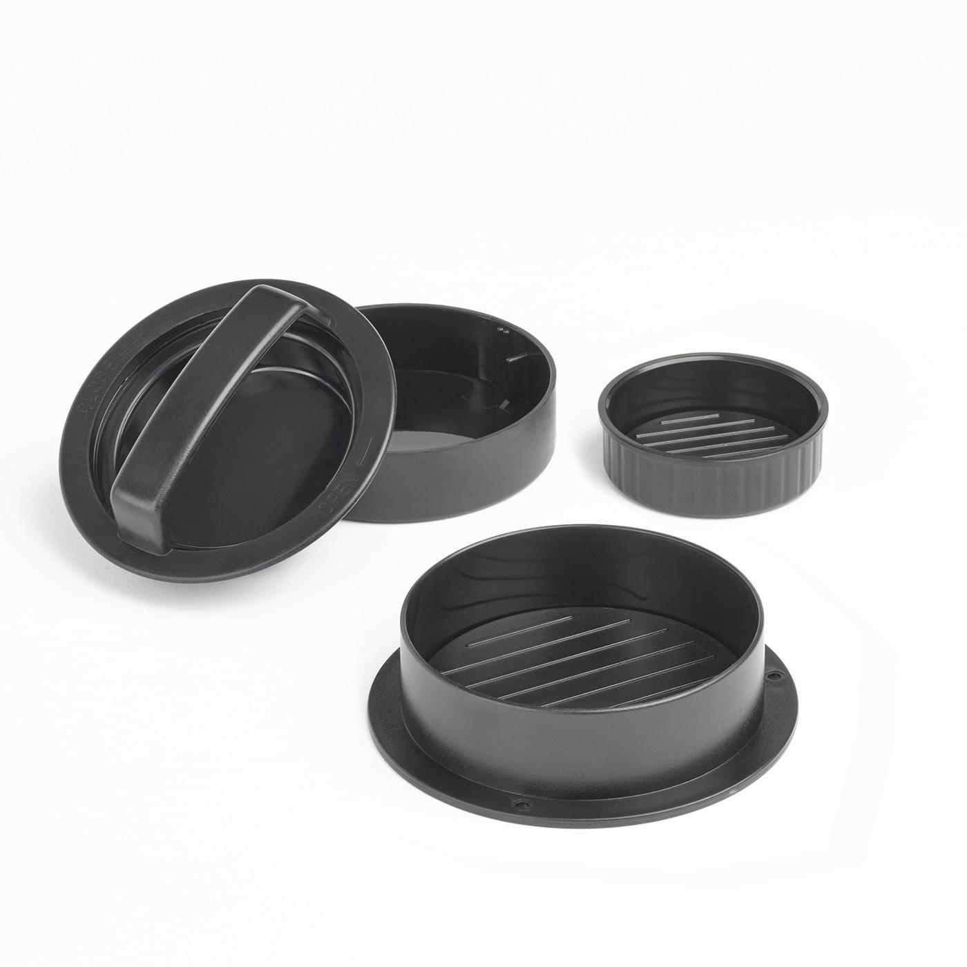 Schwarzer Burger-Former, bestehend aus Deckel, Ring und Pressform.