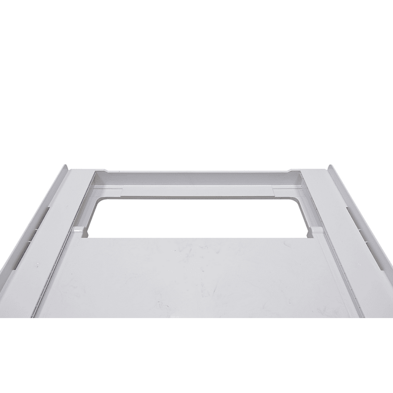 Gray rectangular metal panel. Rectangular opening in the center.