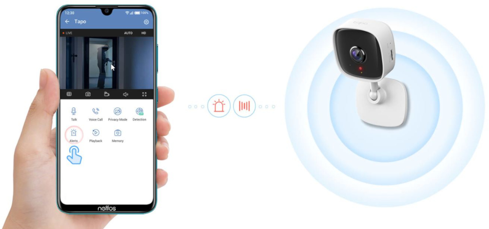 A hand holding a phone displaying a security camera feed and a security camera.