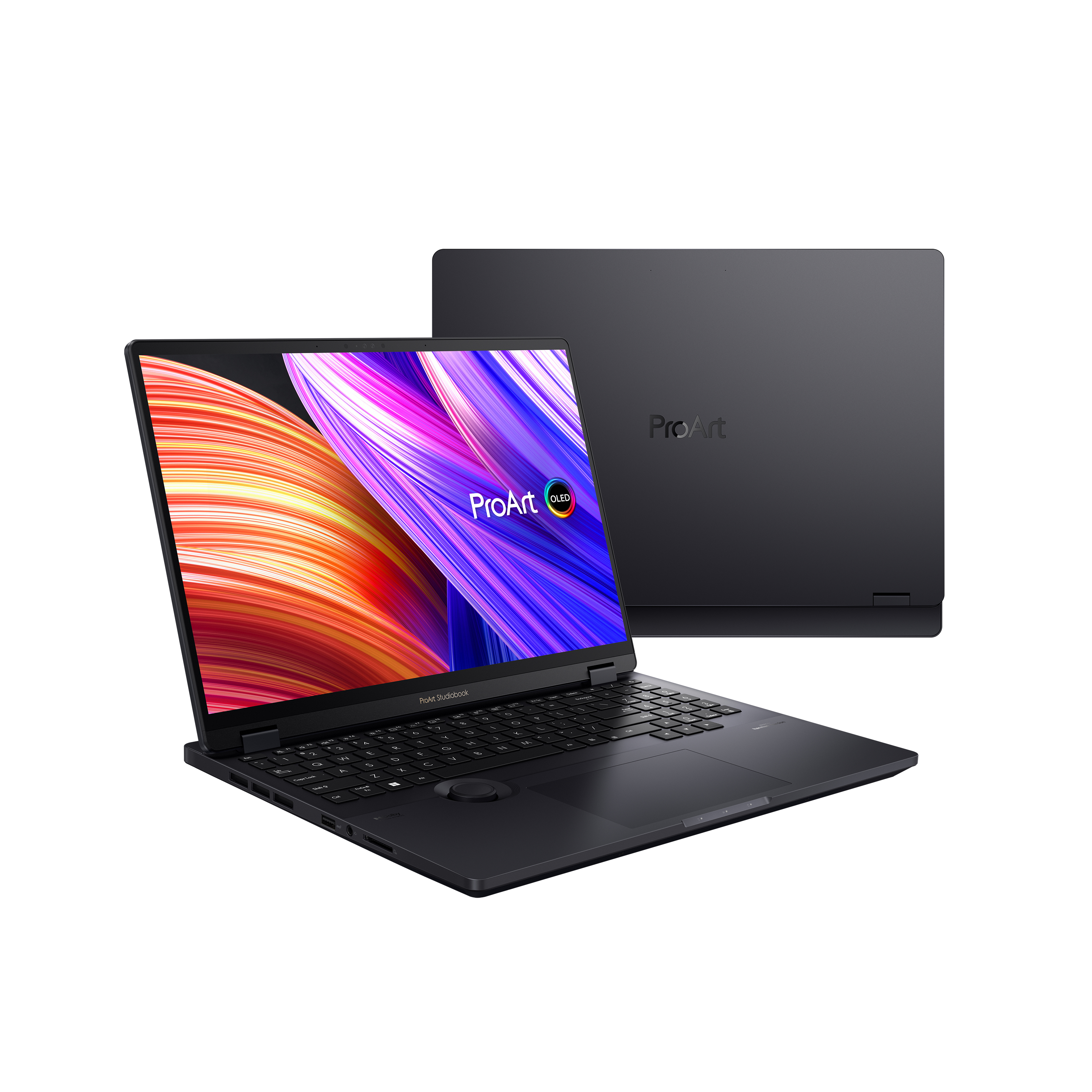Ein schwarzer Laptop mit einem farbenfrohen Bildschirm, der auf einem Tisch geöffnet ist. Das Display zeigt ein ProArt-Logo.