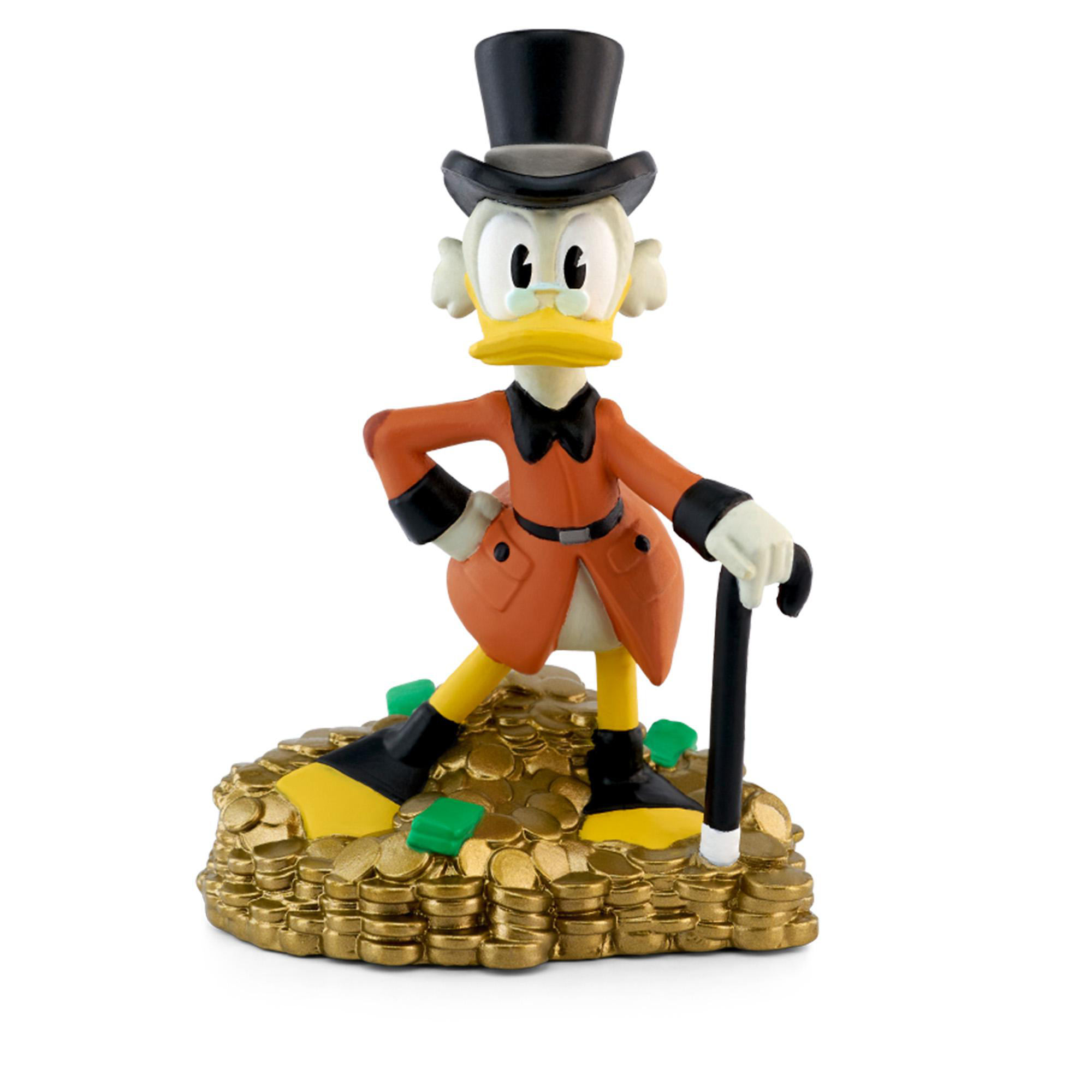 Dagobert Duck Figur steht auf Goldmünzen und hält einen Stock.