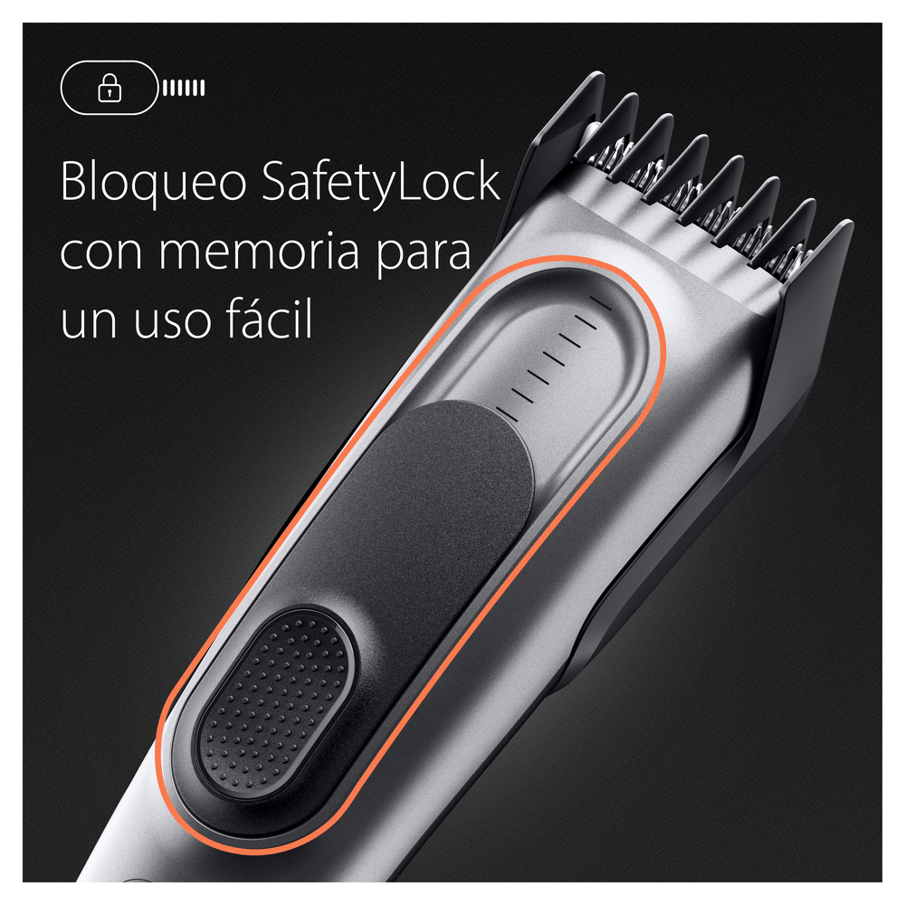 Primer plano de una cortadora de cabello plateada y negra. Tiene un bloqueo de seguridad y una zona de agarre texturizada.