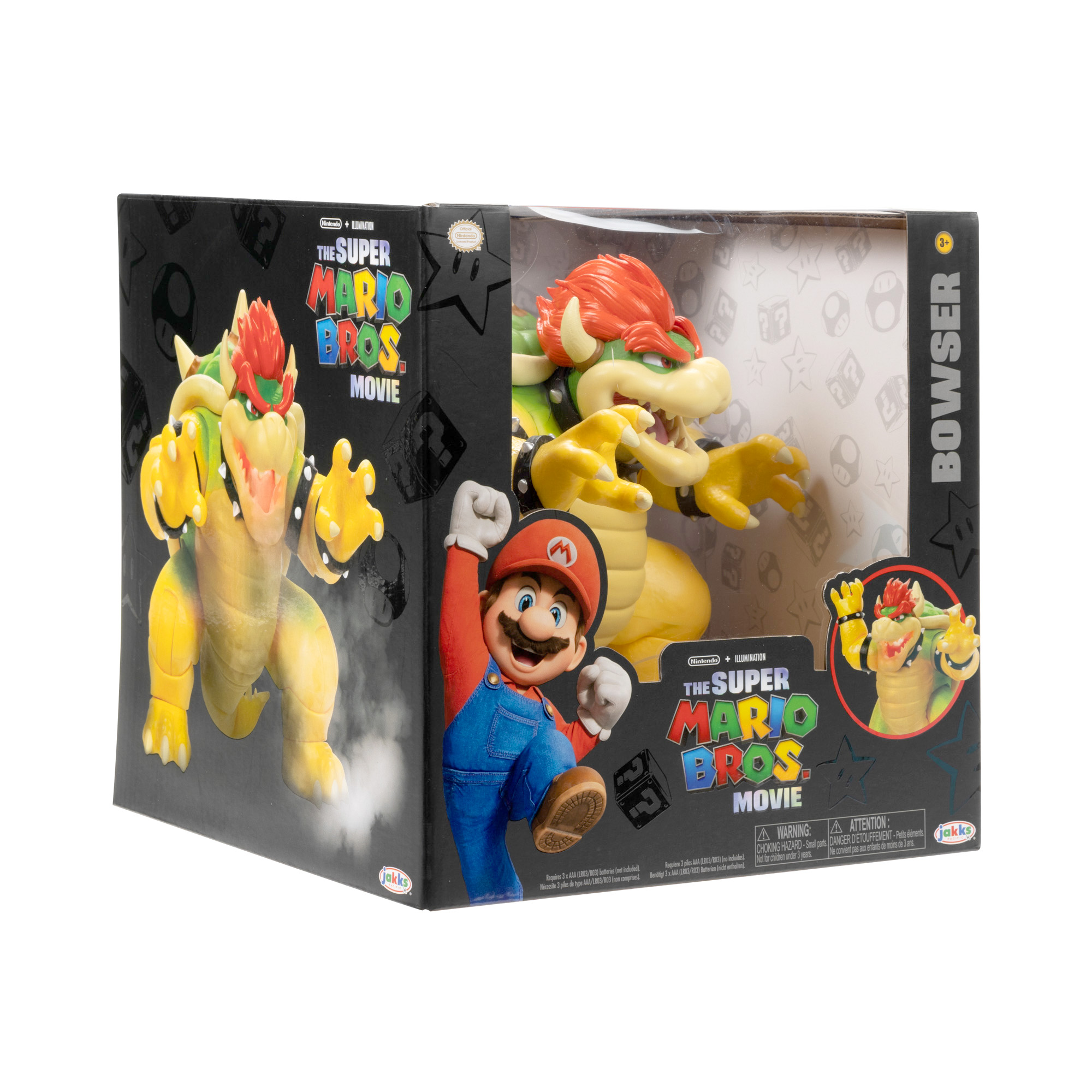 Bowser-Spielzeug in der Box mit Mario-Figur. Box ist schwarz mit Film-Grafiken. Bowser ist gelb und grün.