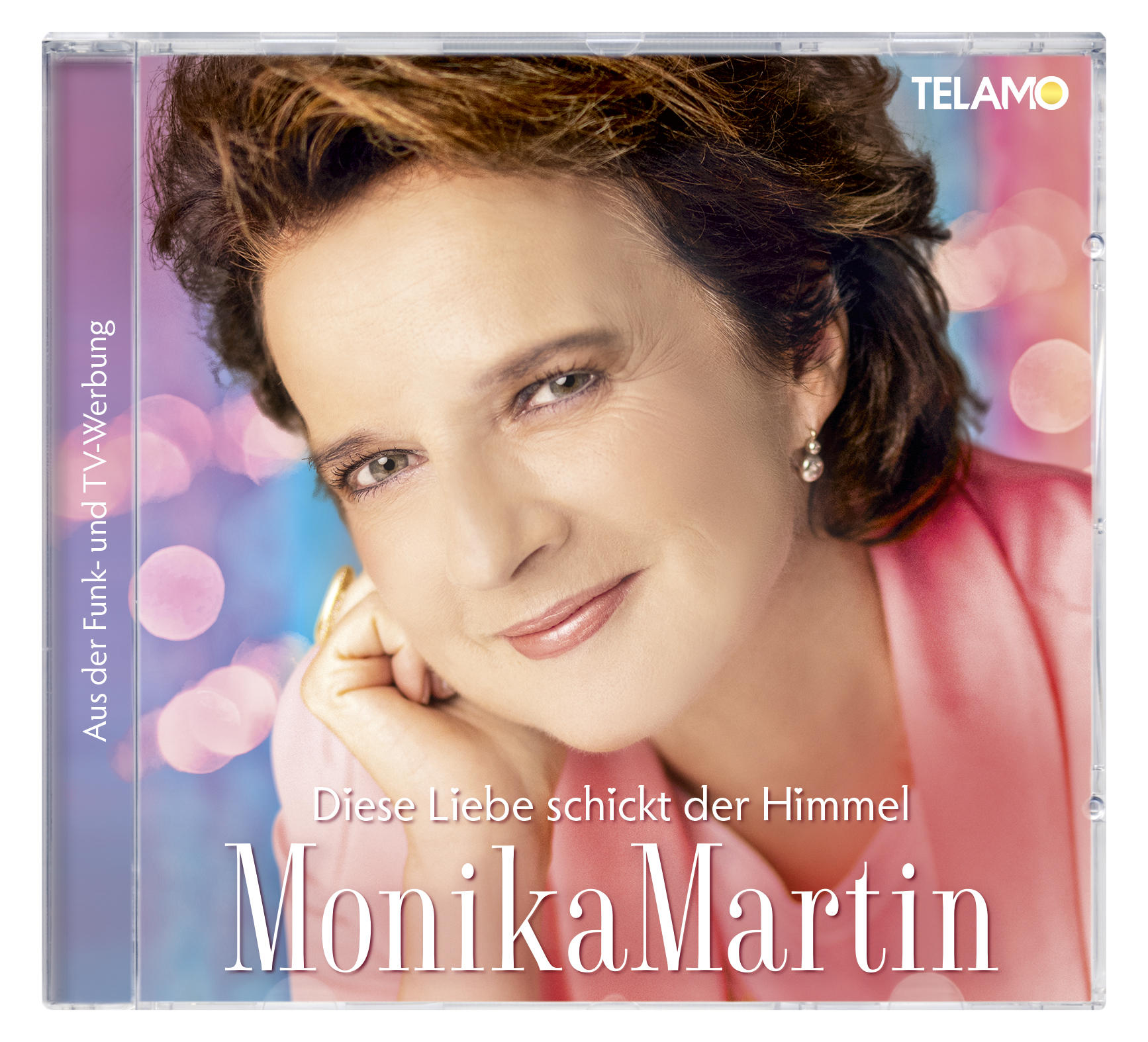 CD-Cover von Monika Martin, eine Frau mit pinkfarbenem Oberteil, Titel 'Diese Liebe schickt der Himmel'.