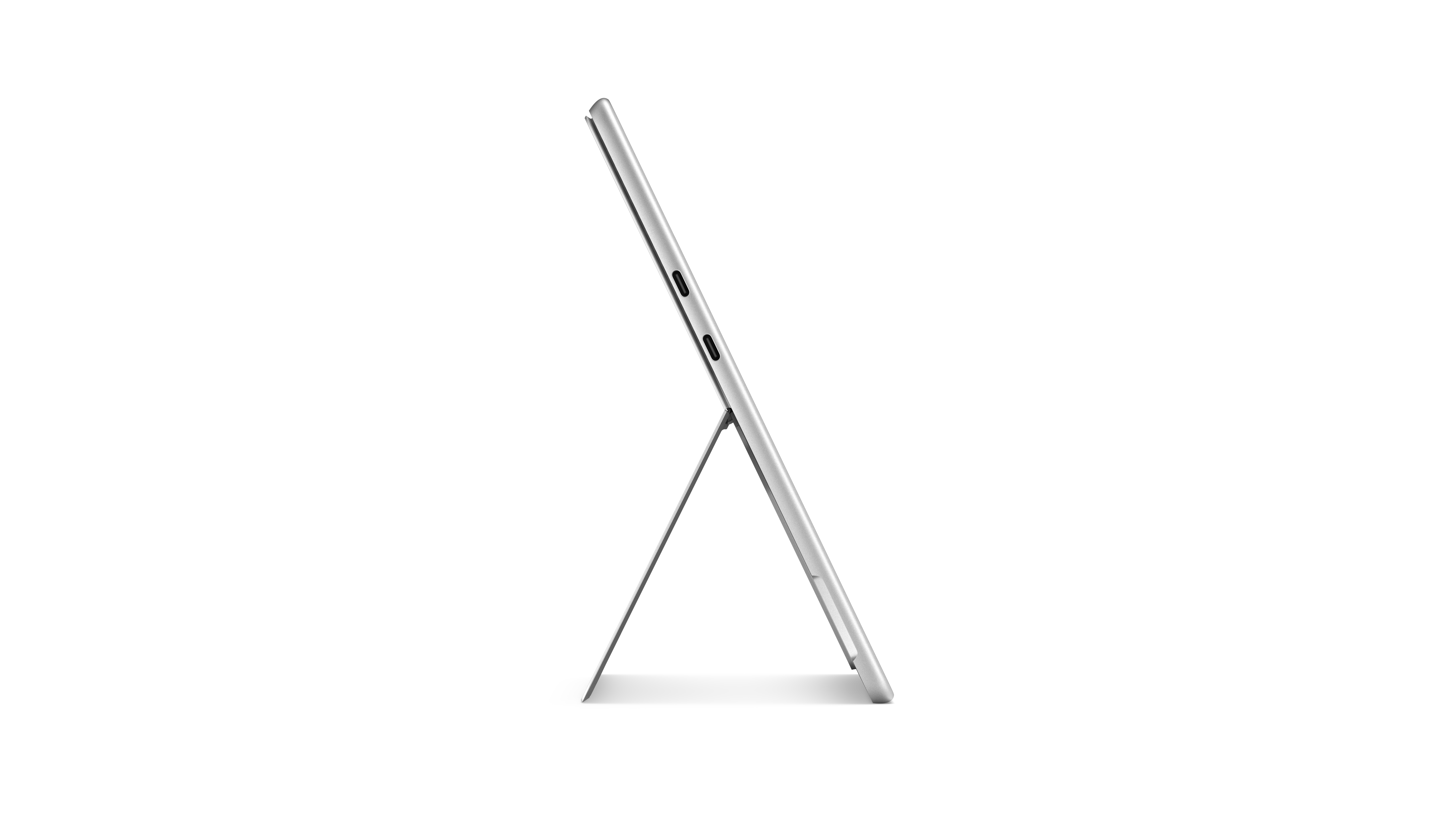 Een zilveren tablet tegen een zwarte achtergrond.