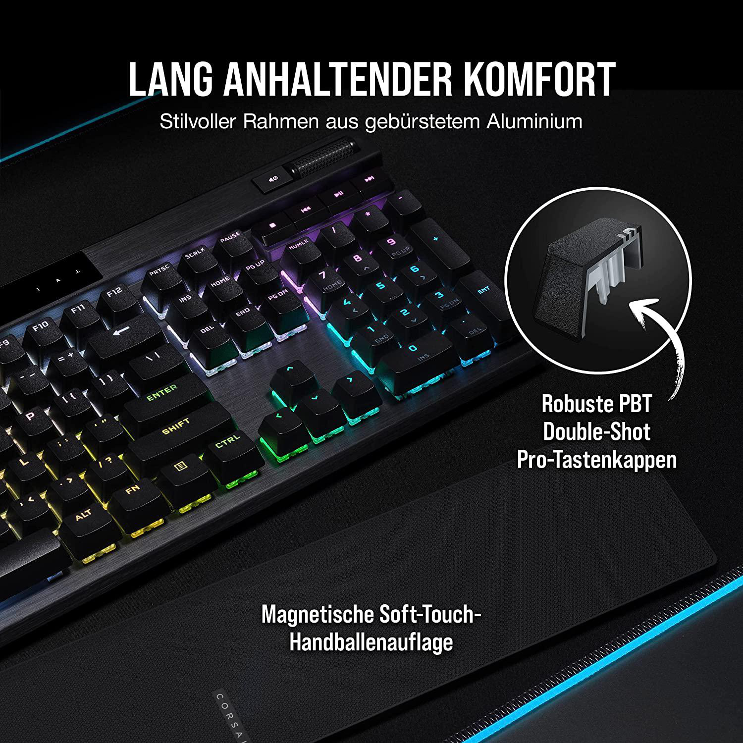 Eine Tastatur mit beleuchteten Tasten und Handballenauflage, schwarz und grau.