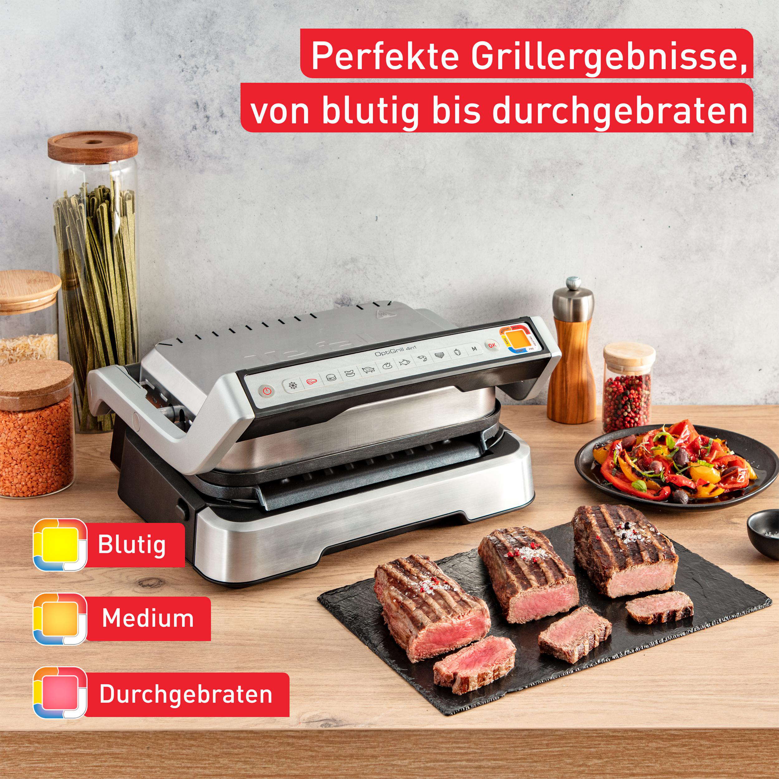 Indoor-Grill mit gekochten Steaks und farbcodierten Garstufen.