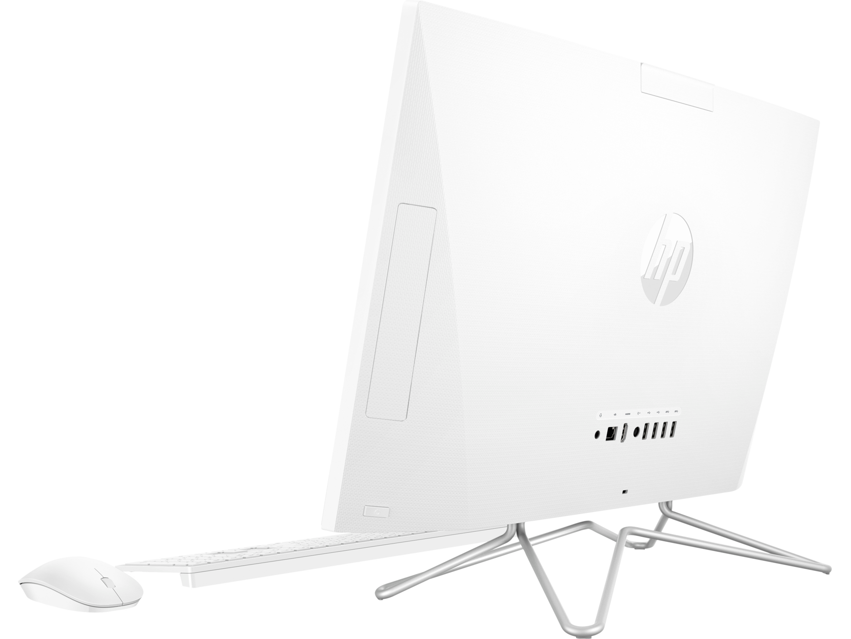 Ordenador HP blanco, vista trasera, con teclado y ratón, sobre una mesa blanca.