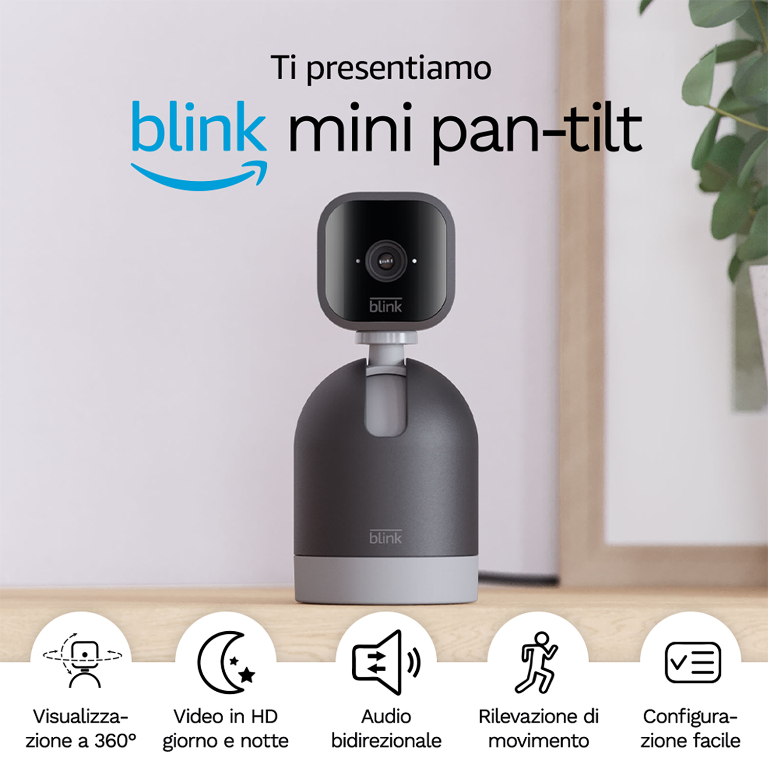 Telecamera Blink Mini Pan-Tilt su una superficie in legno con icone e testo.