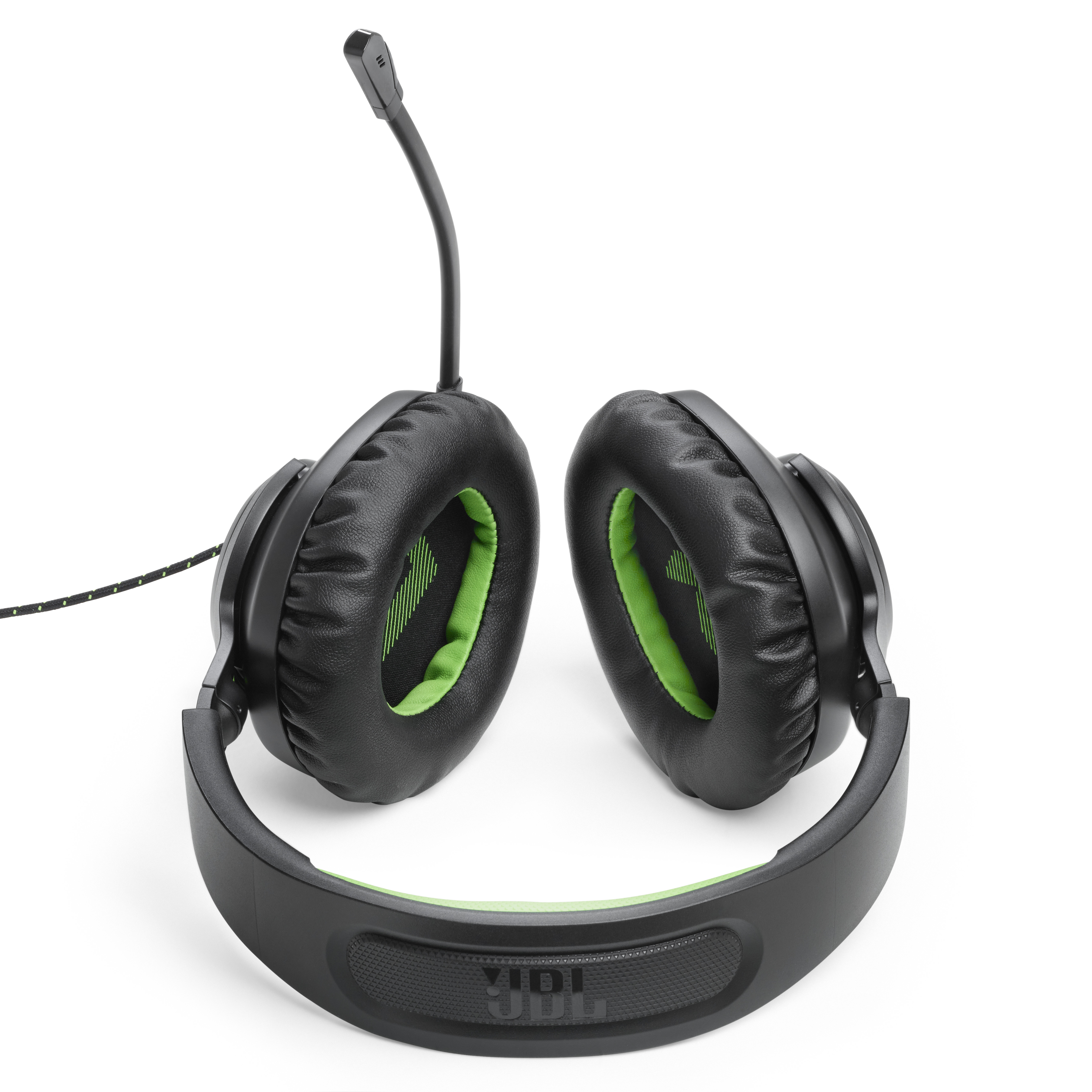 Schwarze und grüne Gaming-Kopfhörer mit Mikrofon, von oben gesehen.