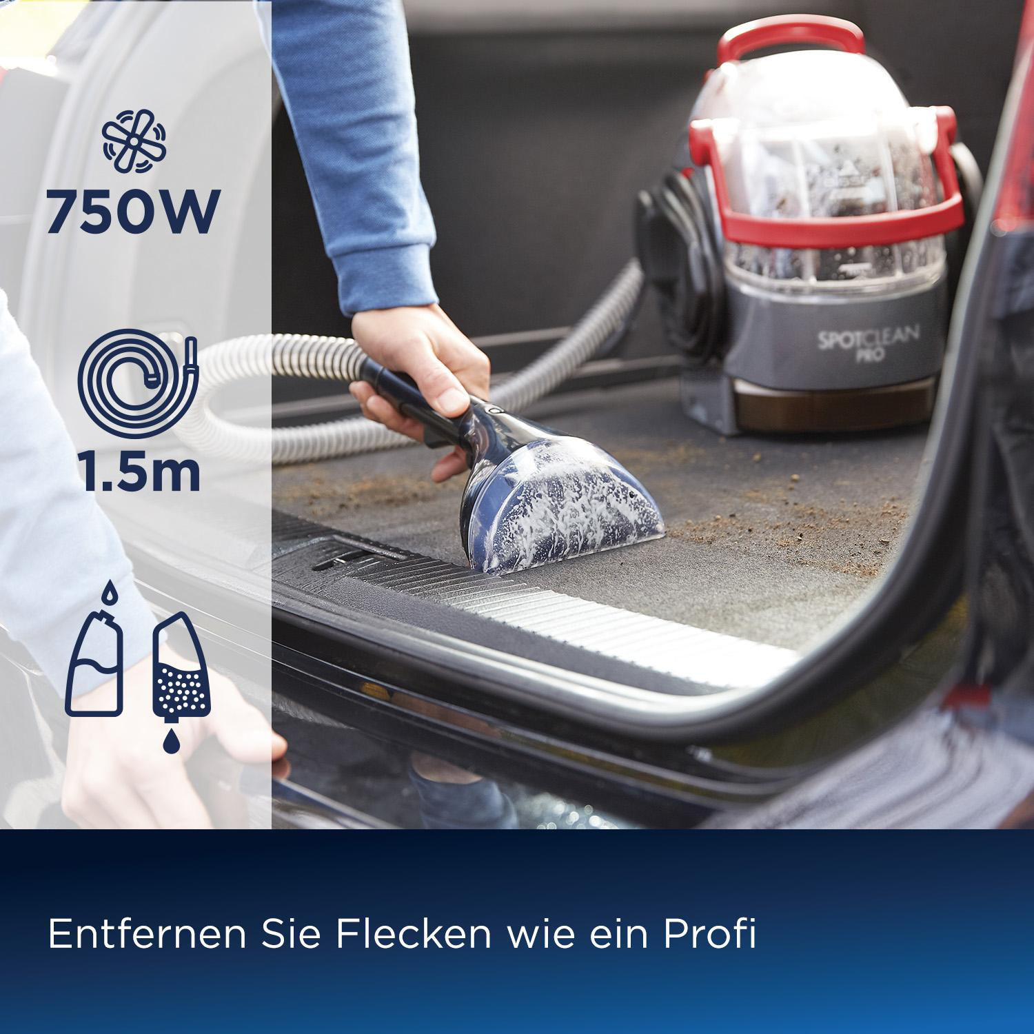 Eine Person verwendet einen SpotClean Pro Staubsauger auf dem Autoboden. Die Maschine ist rot und grau.