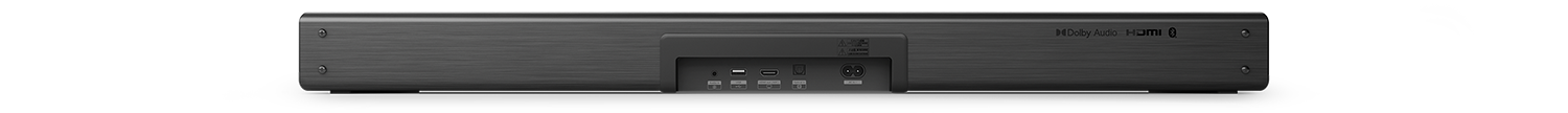 Zwarte soundbar achterkant met poorten en aansluitingen. Dolby Audio en HDMI labels zichtbaar.