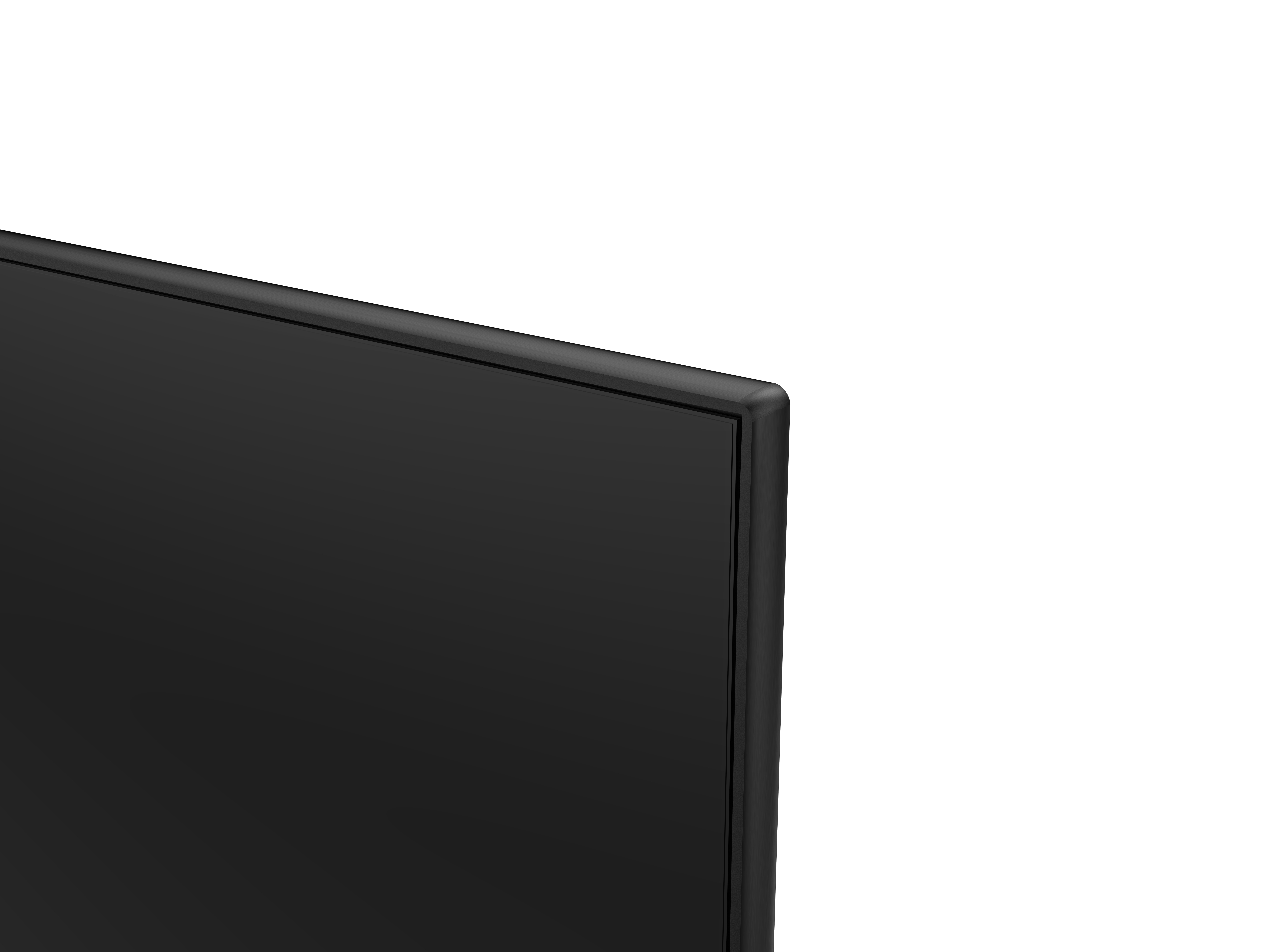 Primer plano de la esquina de una pantalla de televisión negra, fondo blanco.