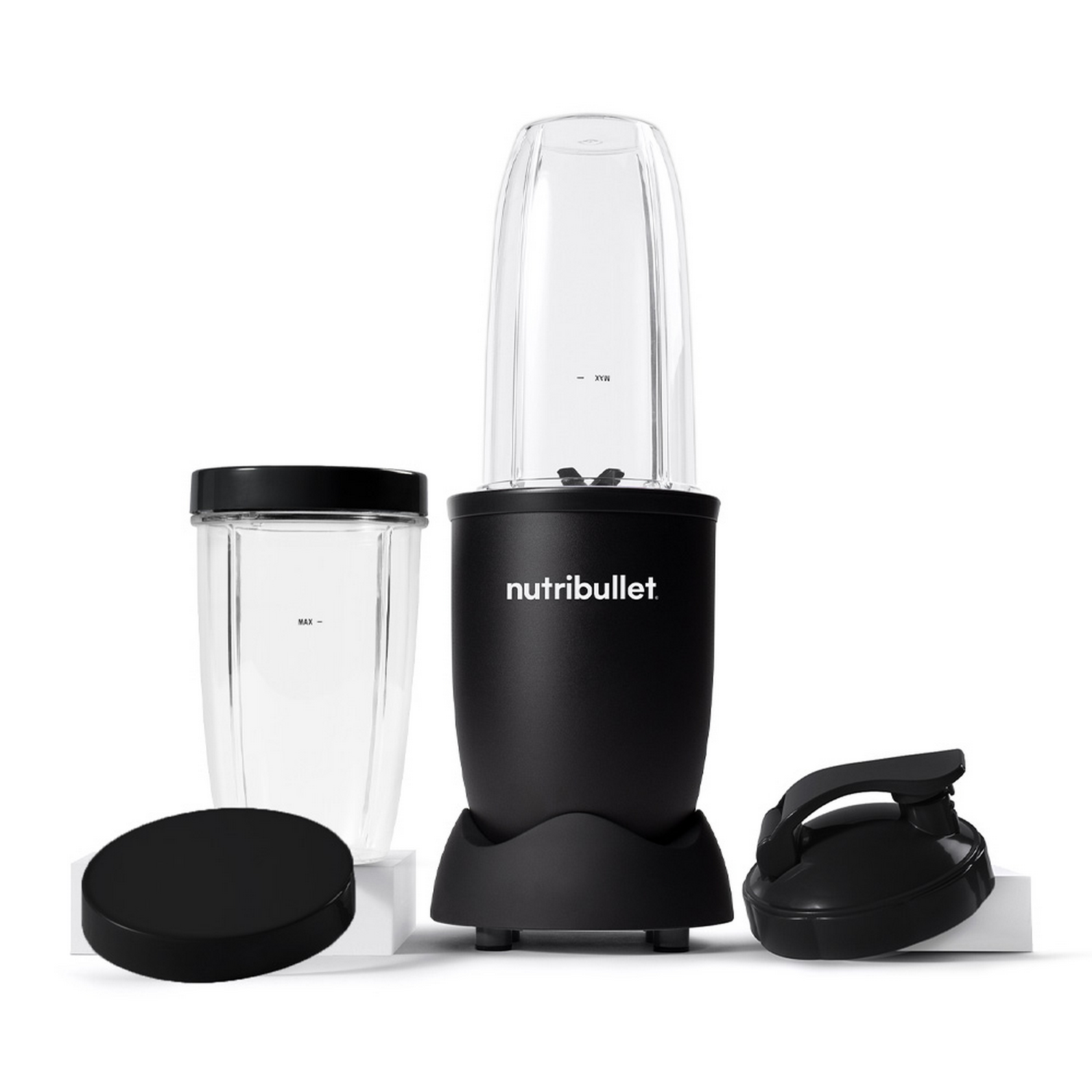 A black Nutribullet blender with multiple parts and accessories. White background.