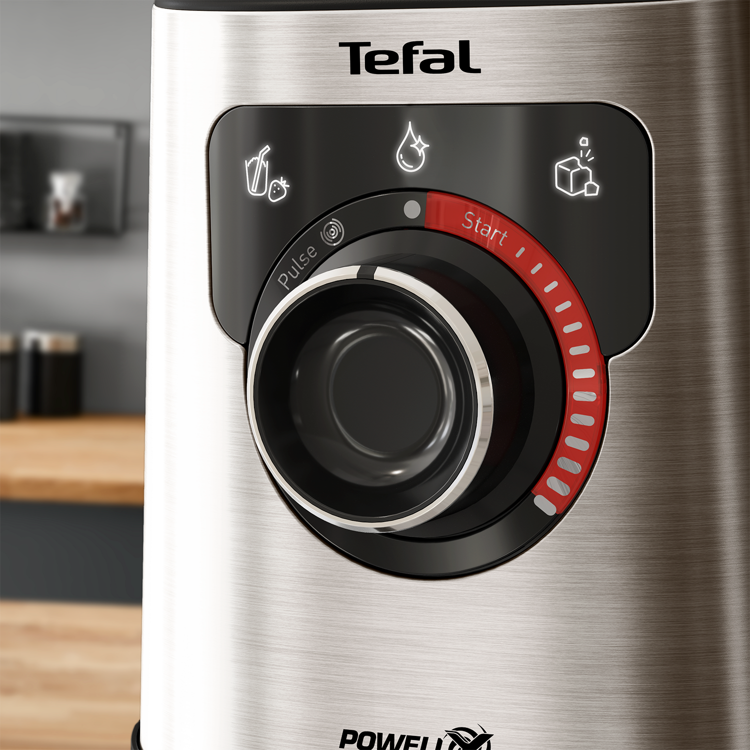 Close-up of a Tefal blender's control panel, with a dial and start button, stainless steel finish.