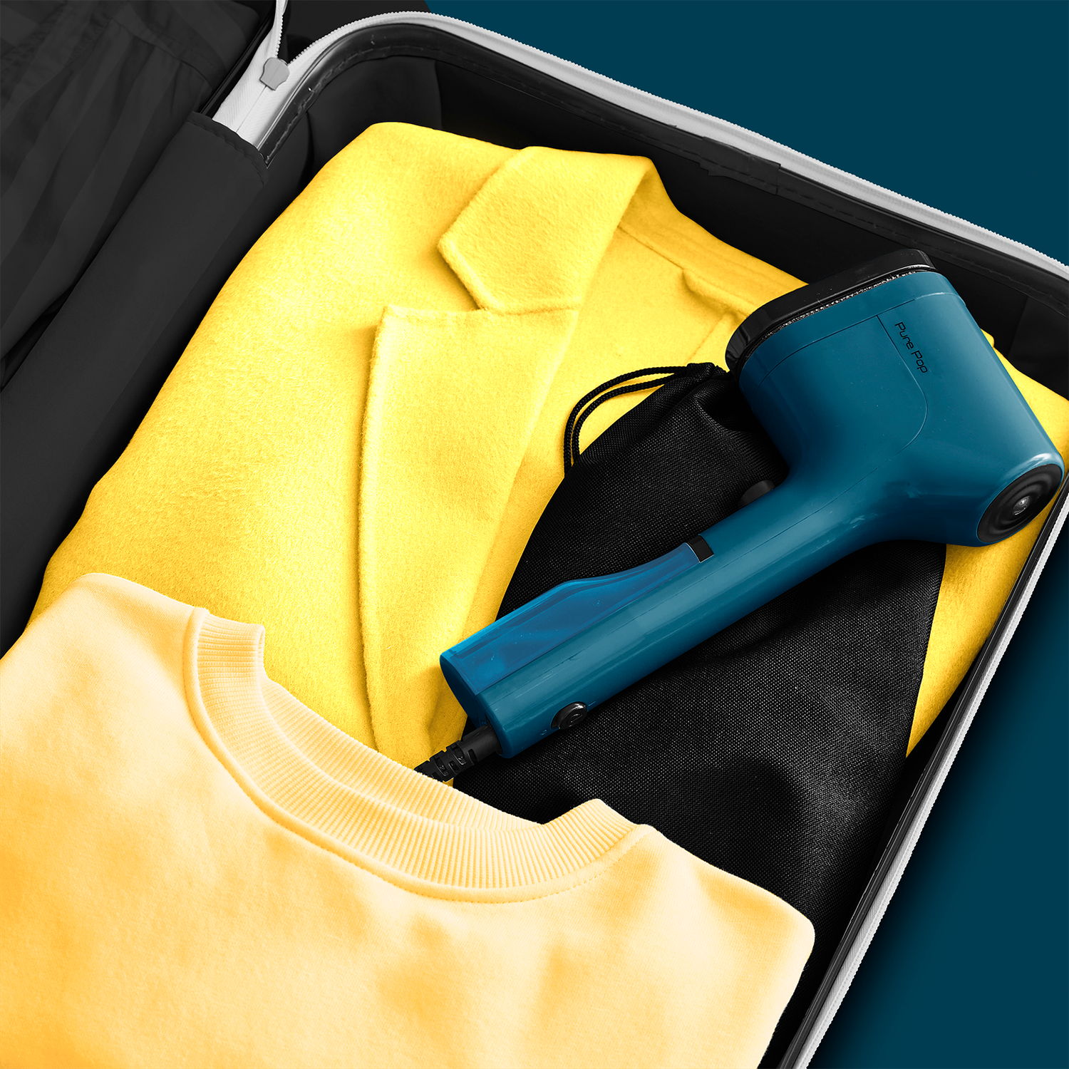 A suitcase with a yellow jacket and a yellow sweater inside and a blue device.