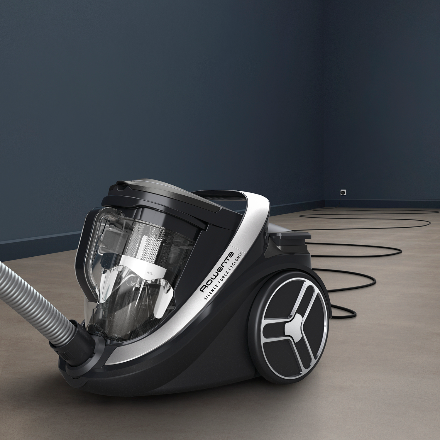 Black and silver vacuum cleaner on a light brown floor.