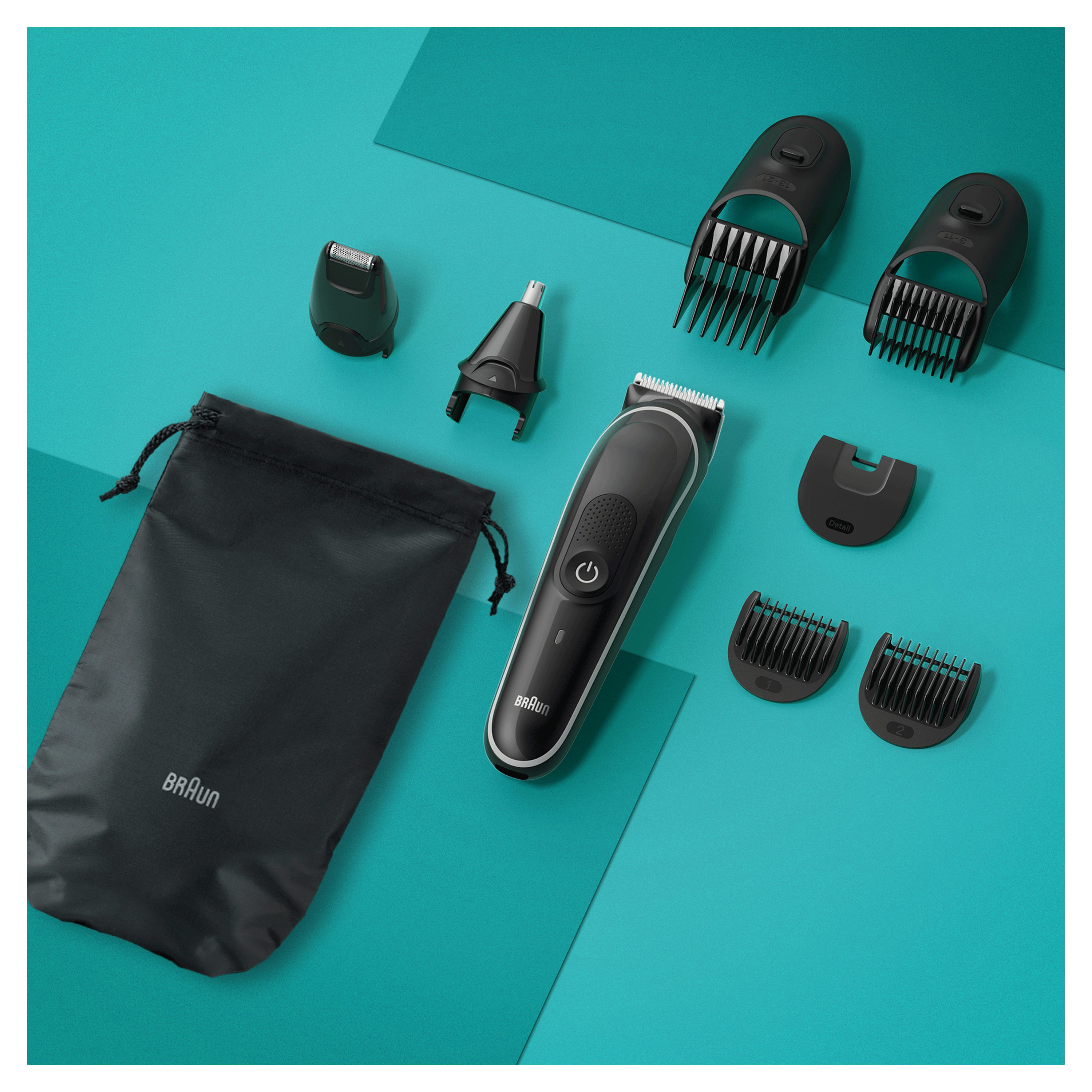 Un kit de aseo con una funda negra y varios accesorios: recortadora, recortadora nasal y guías de peine.